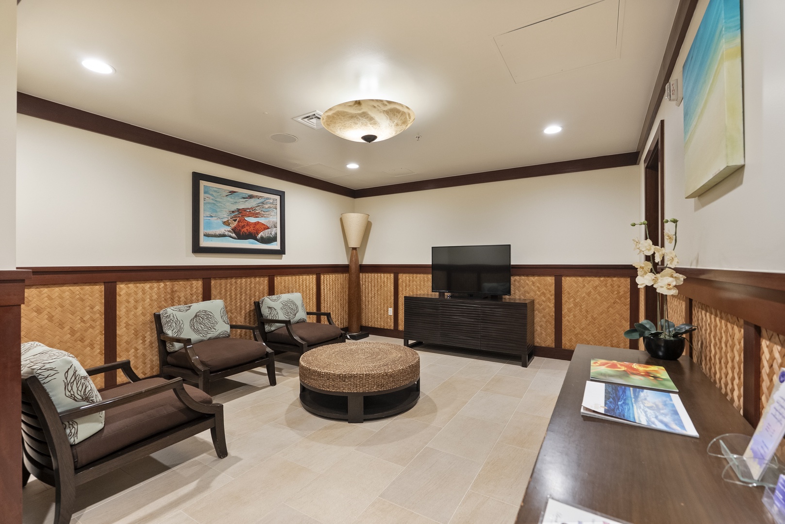 Duck into the residents' lounge for a quiet hour off the sand, wood-paneled and cool.