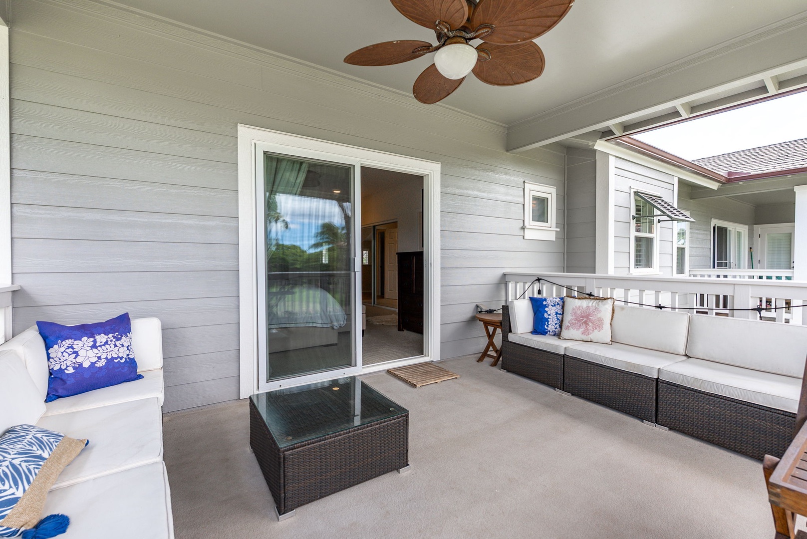 Kapolei Vacation Rentals, Coconut Plantation 1080-4 - Kick back on the lanai sofa where the group ends up between meals.
