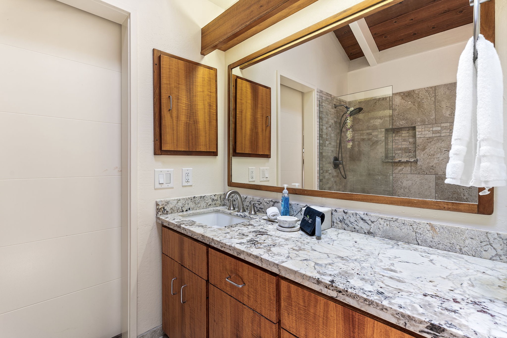 Kailua Kona Vacation Rentals, Kanaloa at Kona 1606 - A robe by the vanity, the walk-in shower just behind.