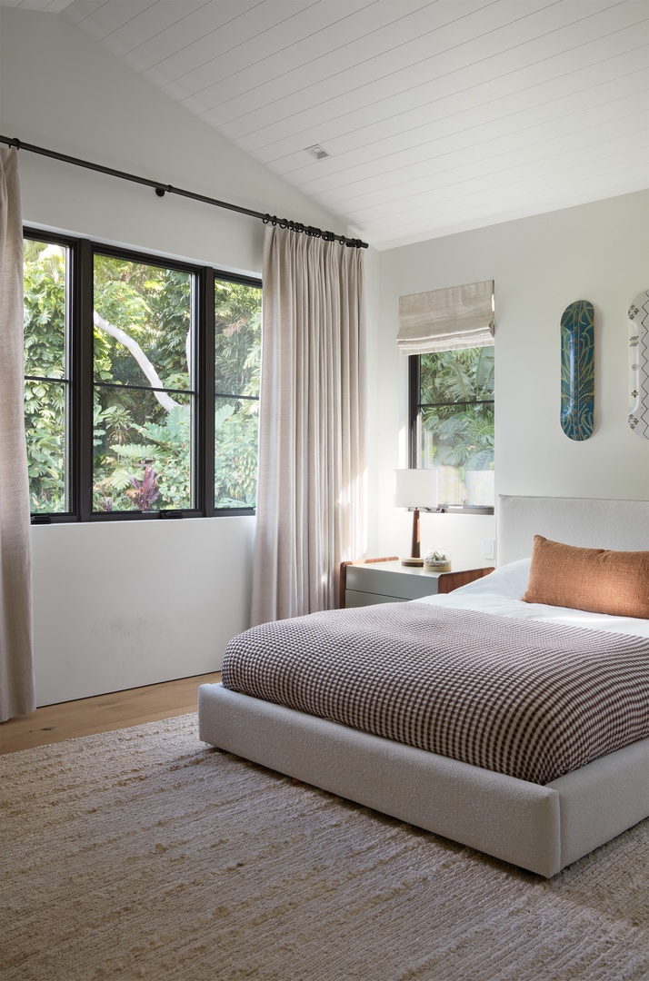 Honolulu Vacation Rentals, Diamond Head Hillside Estate** - Surrounded by lush greenery just beyond the windows, this inviting bedroom offers a quiet place to unwind after a day in Honolulu.