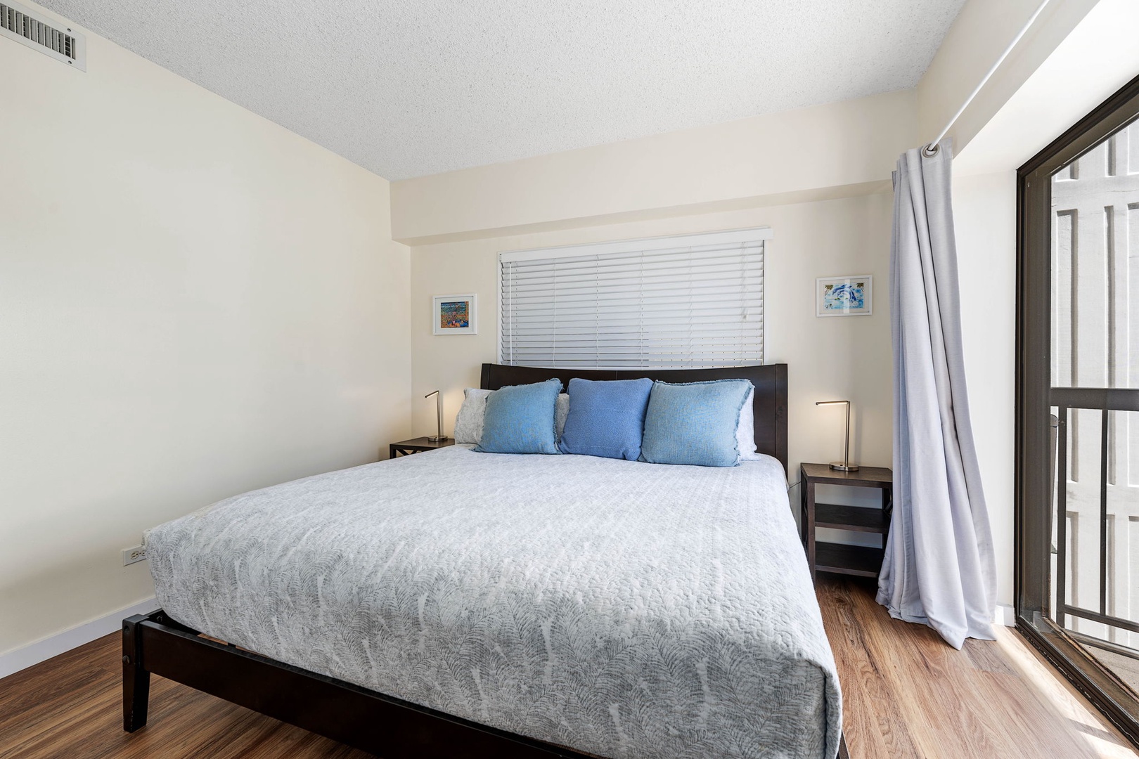 Kailua Kona Vacation Rentals, Kona Plaza 201 - Primary bedroom offering a comfortable king-size bed and serene atmosphere.