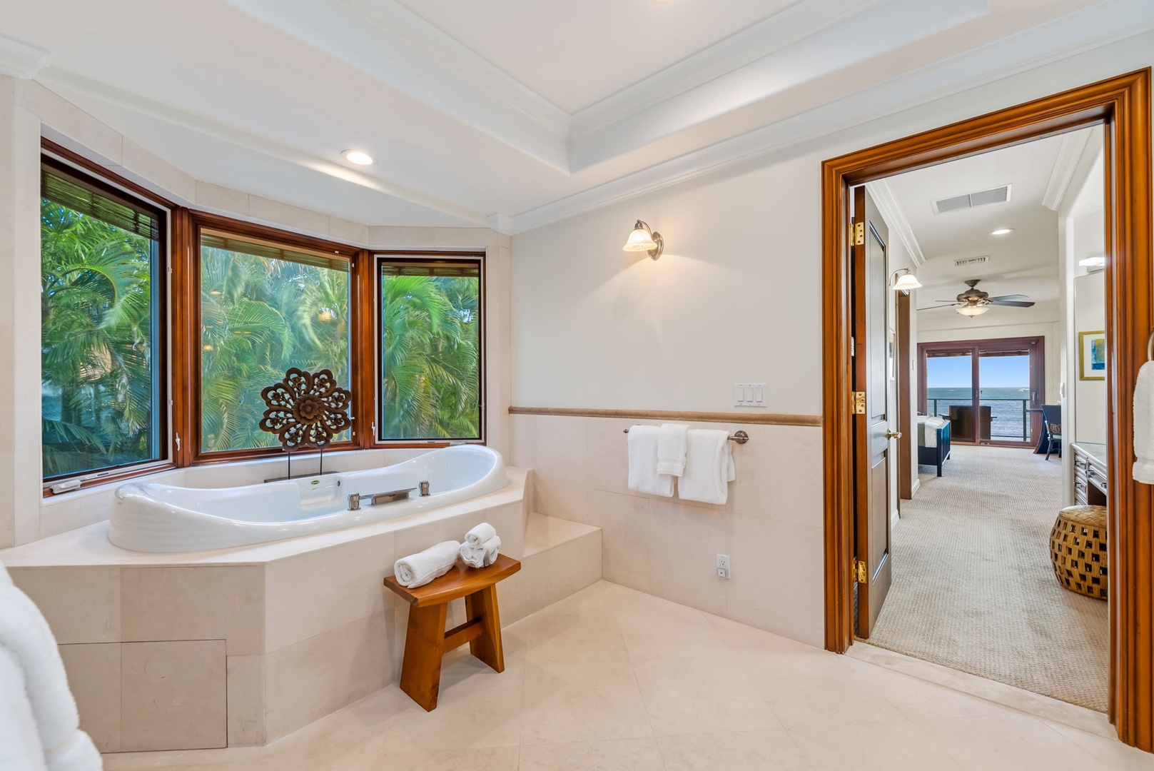 Honolulu Vacation Rentals, Maunalua Estate - Unwind beside the soaking tub as tropical greenery and soft natural light create a calming retreat.