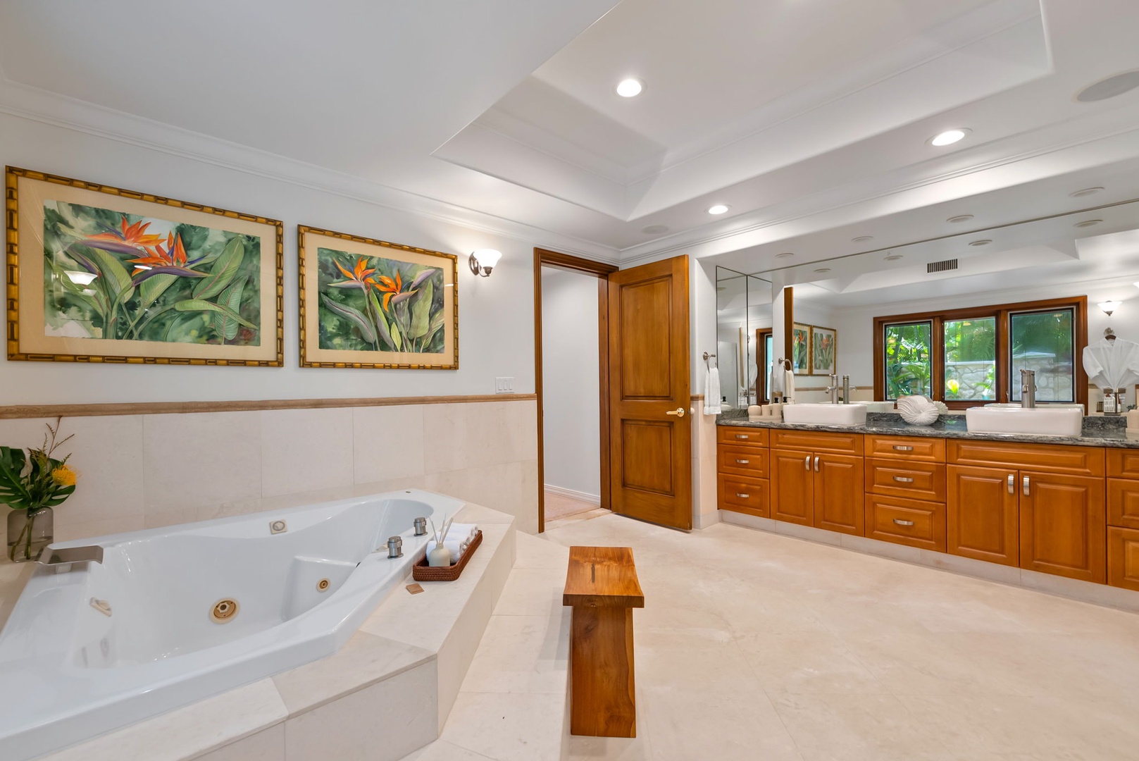 Honolulu Vacation Rentals, Maunalua Estate - A spa-like soaking tub, warm wood finishes, and tropical artwork create a peaceful retreat indoors.