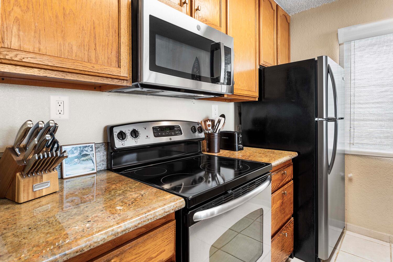 Kailua Kona Vacation Rentals, Kona Reef F11 - The kitchen features top of the line appliances for your culinary ventures.