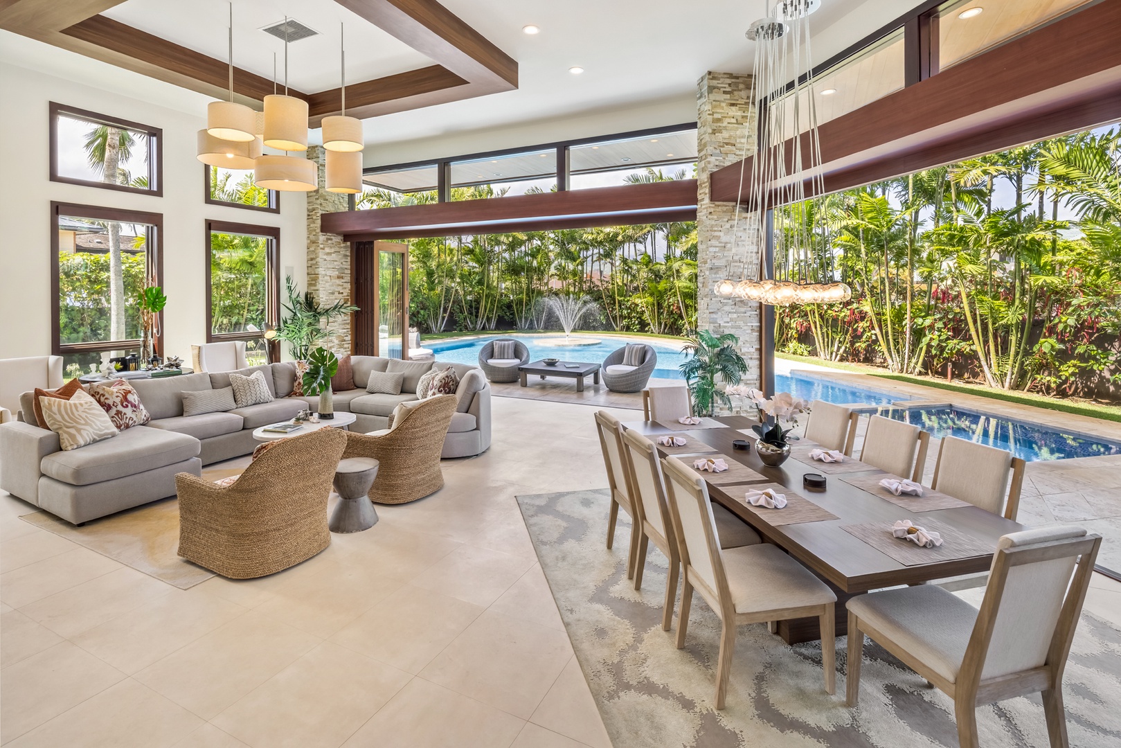 Honolulu Vacation Rentals, Kahala Grand Splendor - Relax and dine in the open-concept living and dining area with beautiful poolside views.