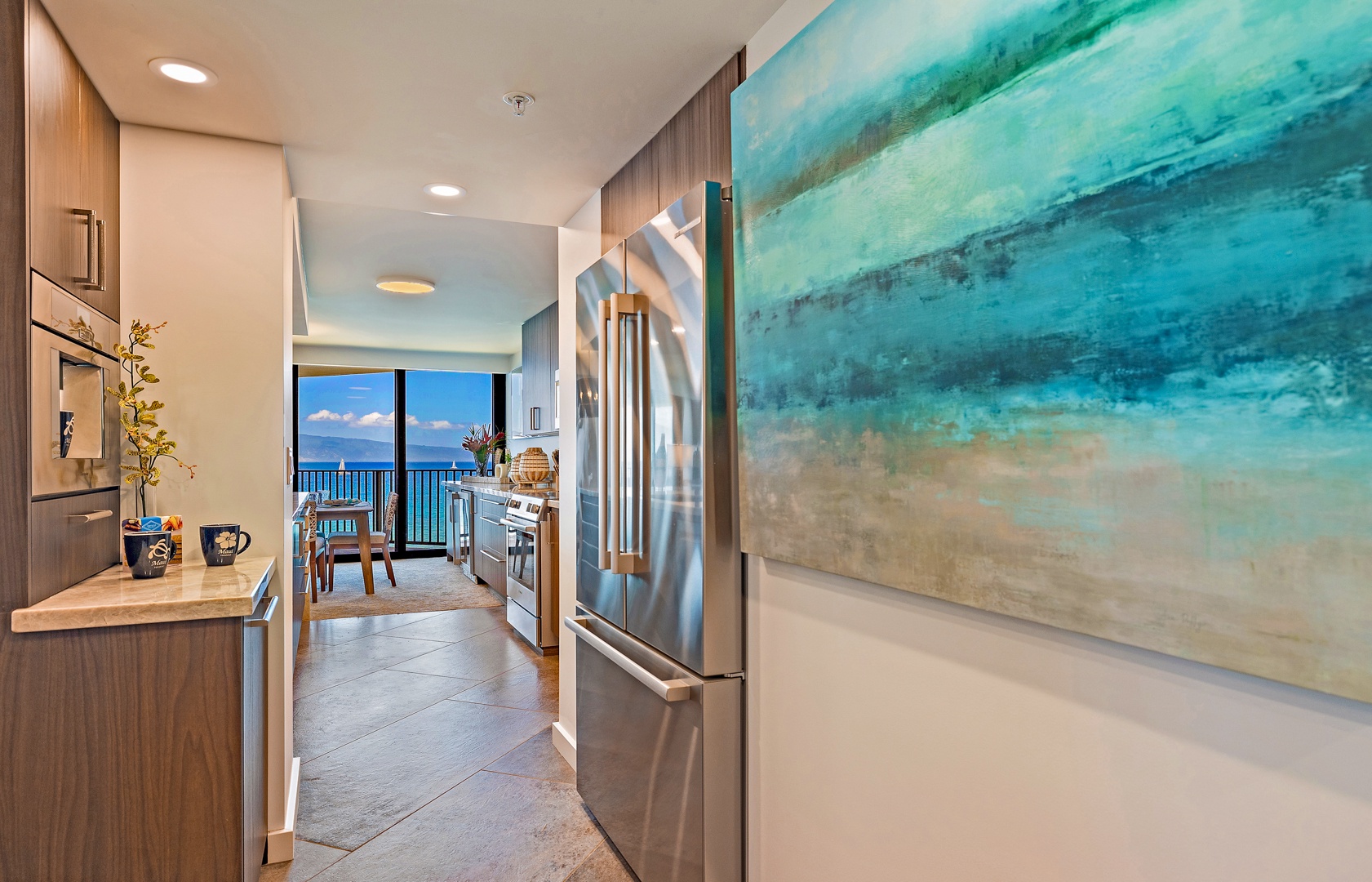 Lahaina Vacation Rentals, Kaanapali Shores 702 - A modern kitchen with ocean views that make cooking feel like a tropical escape.