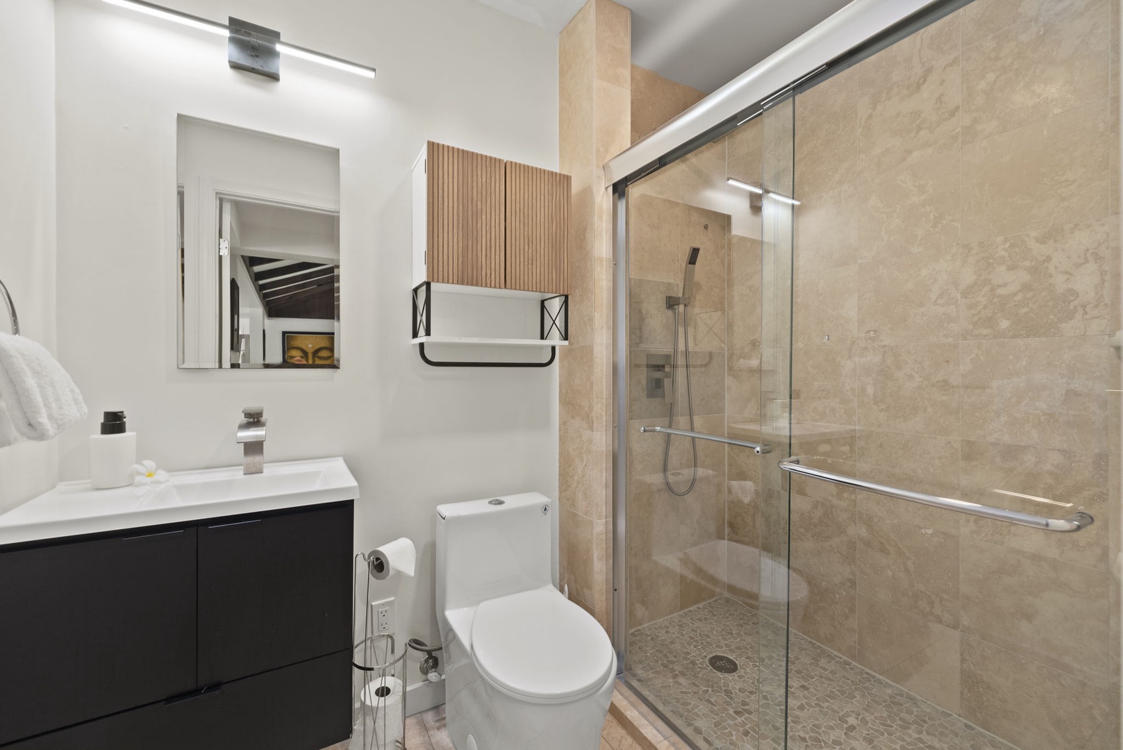Honolulu Vacation Rentals, Kahala Lani - Polished bathroom with glass shower and contemporary styling.