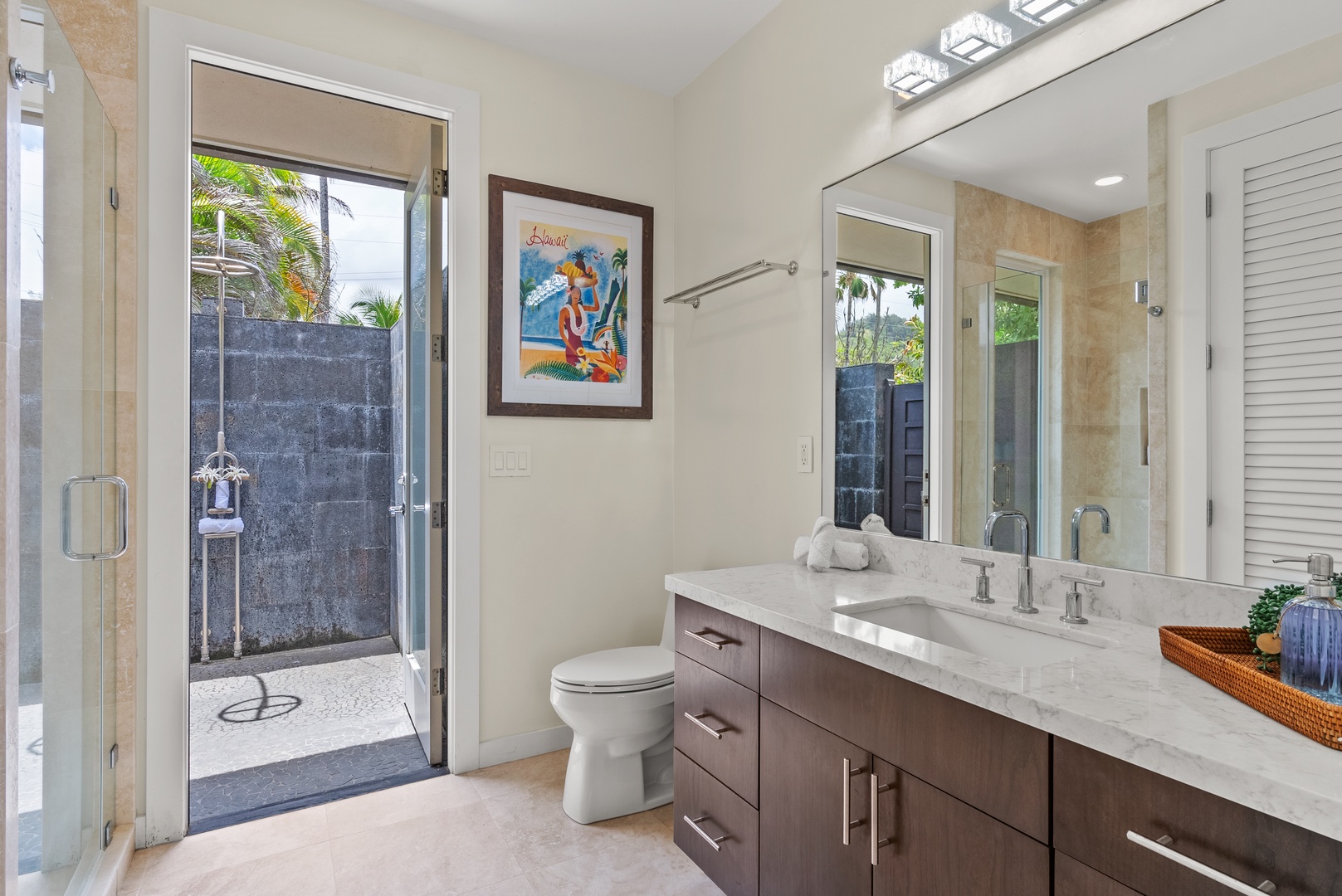 Laie Vacation Rentals, Laie Beachfront Estate - The ensuite bathroom has ample vanity space and an outdoor shower.