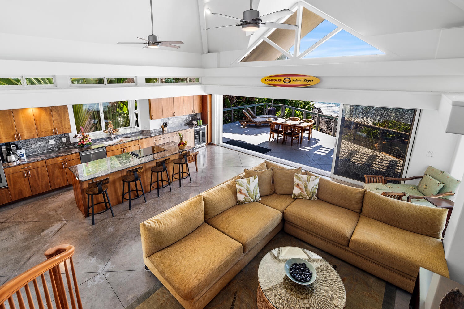 Kailua-Kona Vacation Rentals, Hale Kope Kai - Indoor-outdoor flow connects the kitchen to lounge seating and dining on the covered lanai.