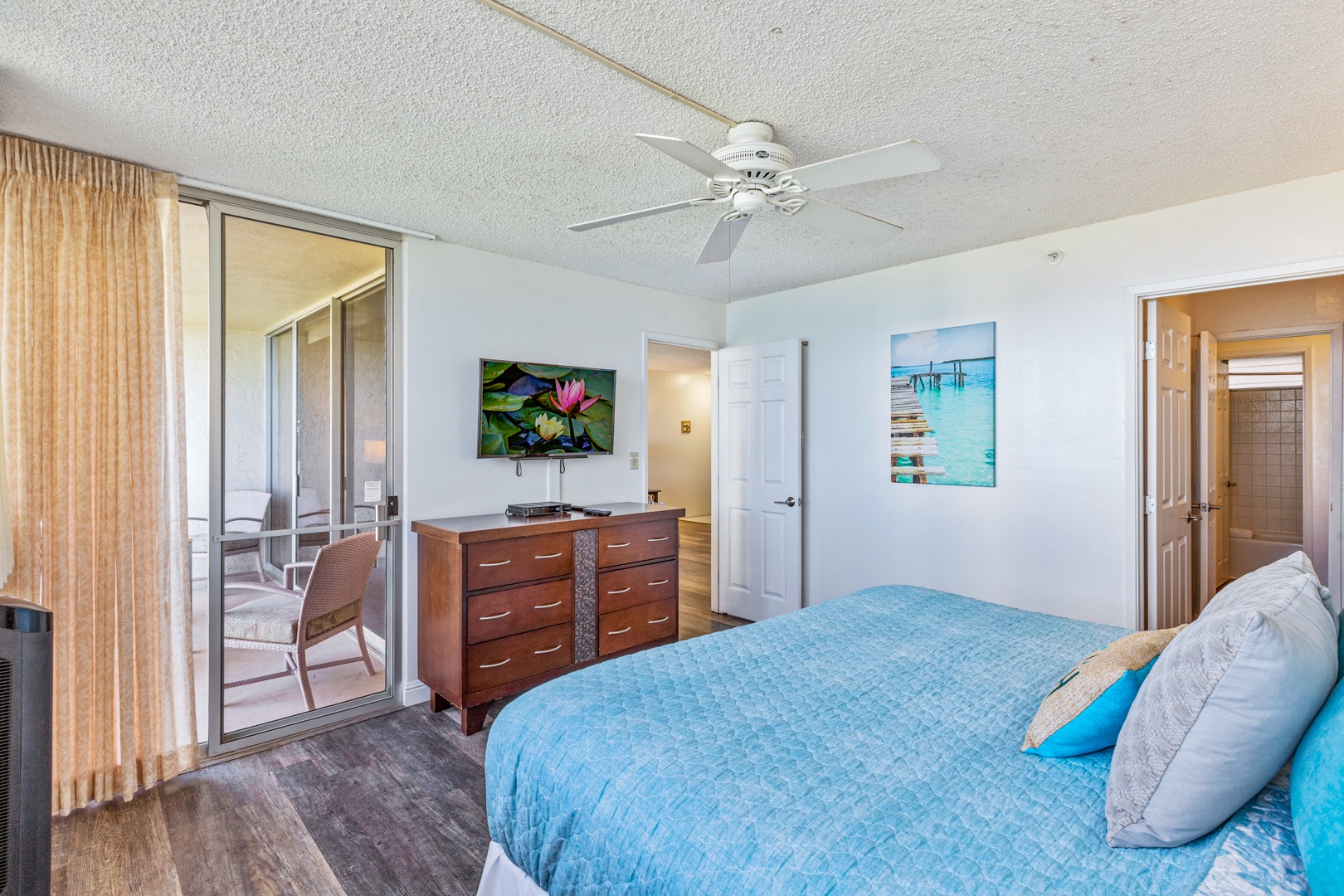 Lahaina Vacation Rentals, Royal Kahana 308 - The bedroom includes direct lanai access, a king-size bed, and a flat-screen TV for your entertainment.