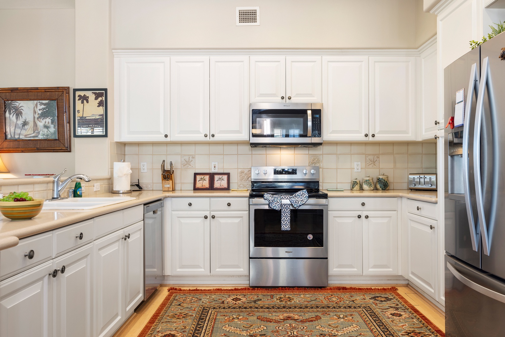 Your bright, fully-equipped kitchen awaits with modern stainless steel appliances and plenty of counter space for preparing meals during your stay.