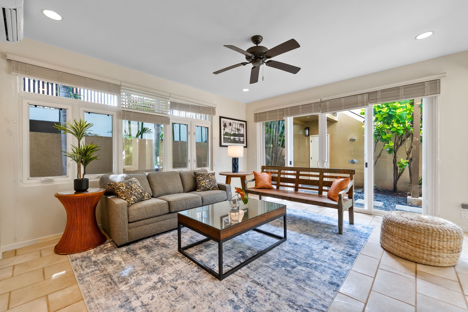 Honolulu Vacation Rentals, Diamond Head Luxe - Sink into the plush sofa and let the ceiling fan's gentle breeze cool you as natural light floods through panoramic windows.