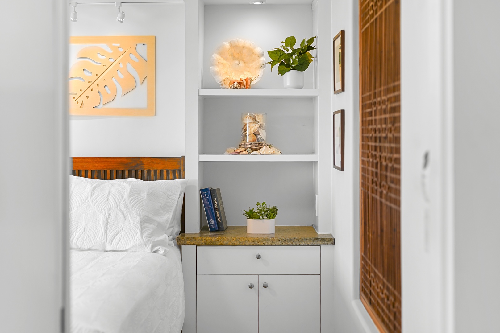 Honolulu Vacation Rentals, Kaimana Shores Getaway - Wake up refreshed in the bright primary bedroom, complete with convenient storage and easy access to the full bathroom.