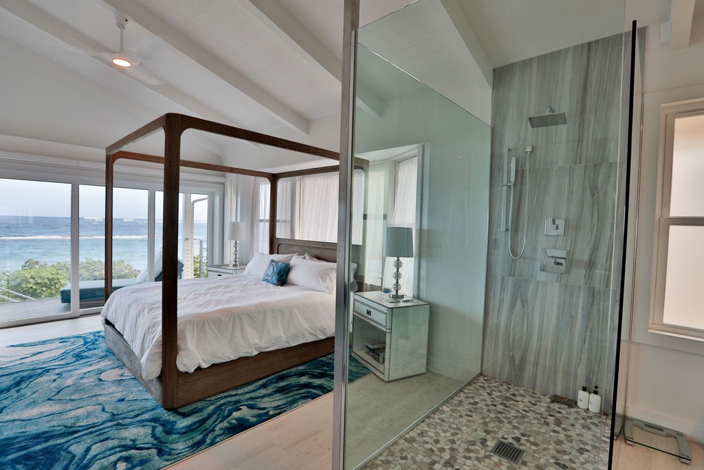 Waialua Vacation Rentals, Sea of Glass* - Primary Bedroom with stand alone shower and ocean views