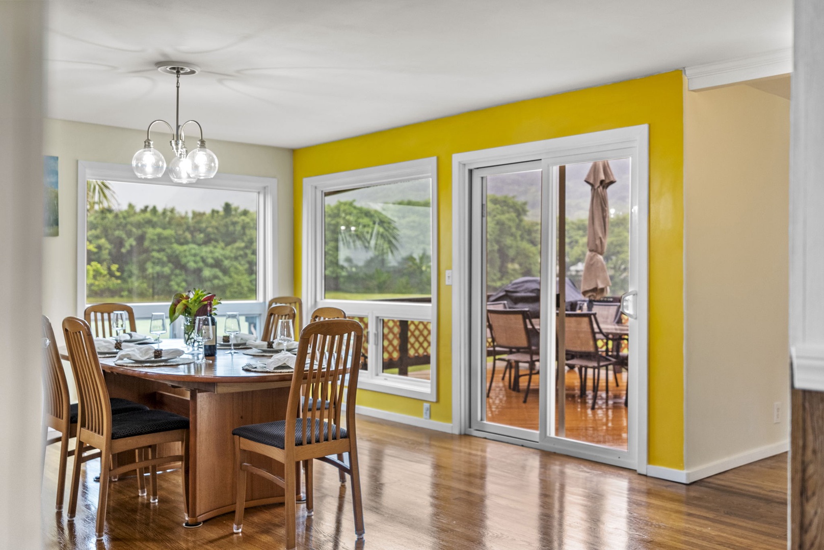 Hauula Vacation Rentals, Mau Loa Hale - Dining area surrounded by window to showcase the landscape