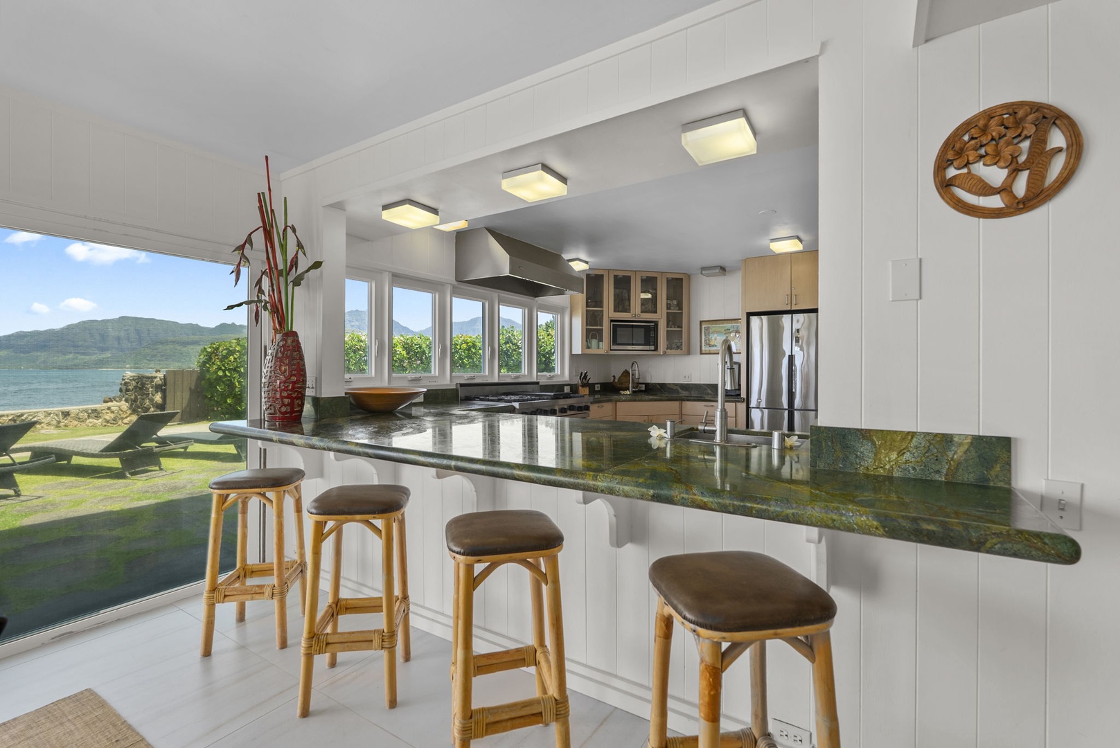 Waianae Vacation Rentals, Ma'ili Blue - Cook your island feast in this stunning kitchen while gazing at panoramic mountain and water views through floor-to-ceiling windows.
