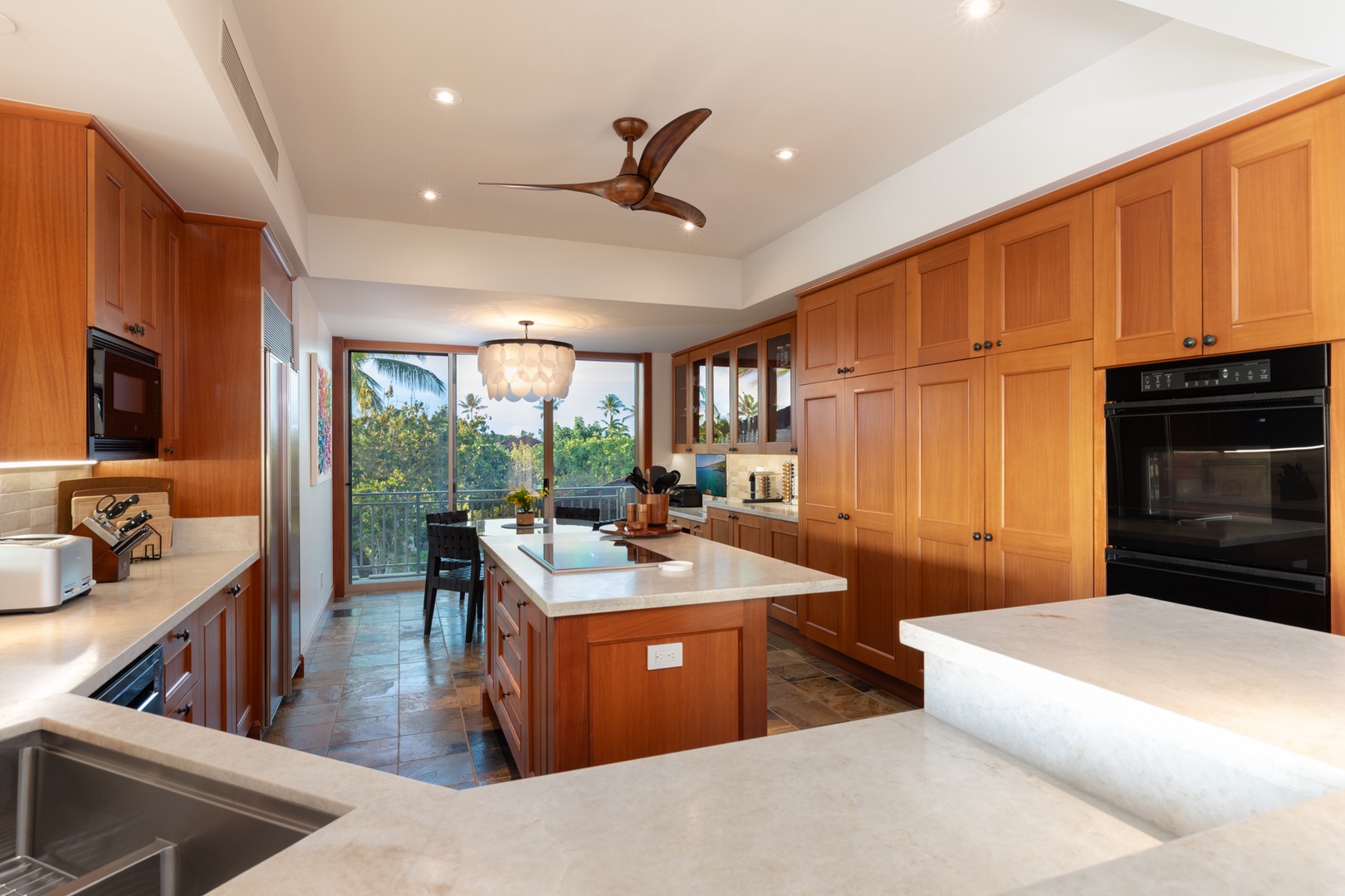 Kailua Kona Vacation Rentals, 3BD Waiulu Villa (111D) at Hualalai Resort - Your gourmet kitchen features rich cabinetry, modern appliances, and tropical views through expansive windows—perfect for memorable meals.