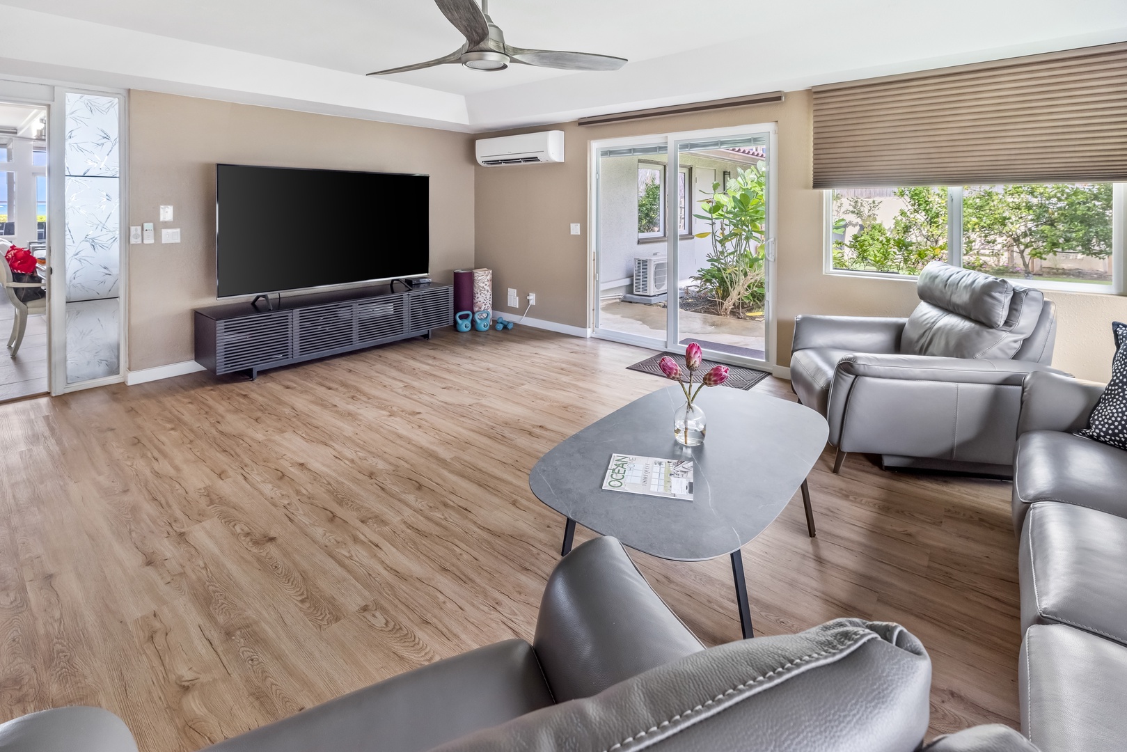 Honolulu Vacation Rentals, Nanea Kai Villa - Spacious media room with a large TV, split AC and easy access to the outdoor patio.