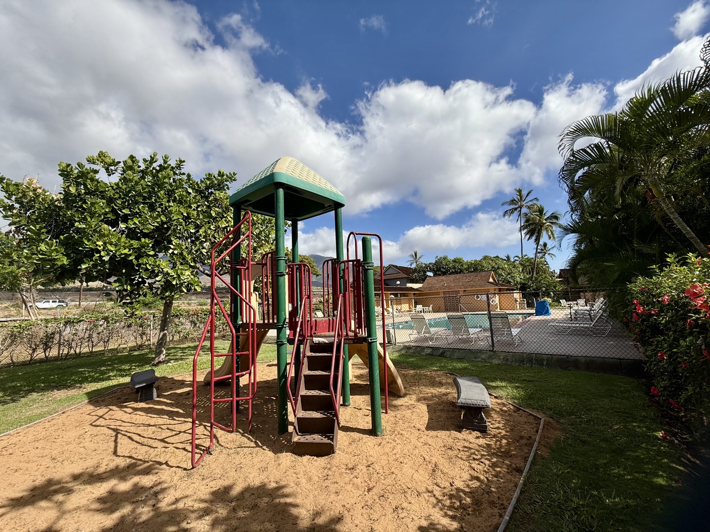 Lahaina Vacation Rentals, Puamana 254-2 - Playground area for kids to enjoy, surrounded by tropical greenery.