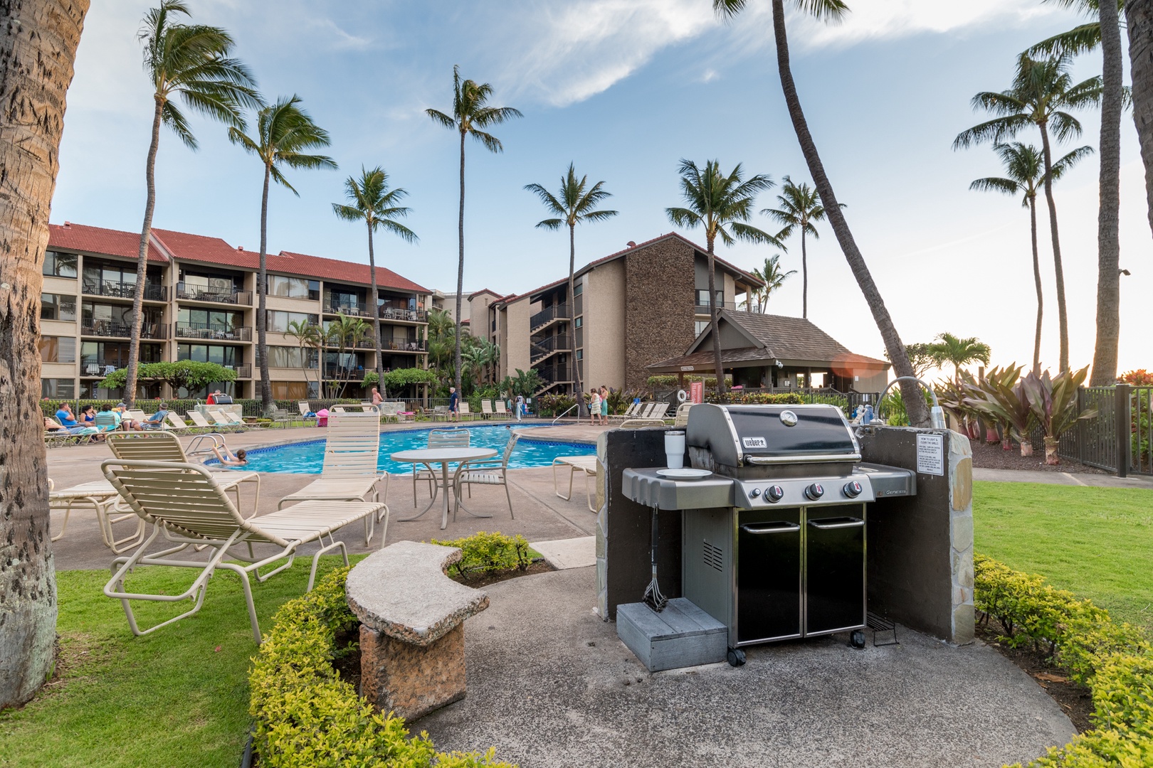 Lahaina Vacation Rentals, Papakea B-105 - Enjoy a perfect outdoor BBQ experience with poolside views, surrounded by swaying palm trees and a relaxing resort atmosphere.