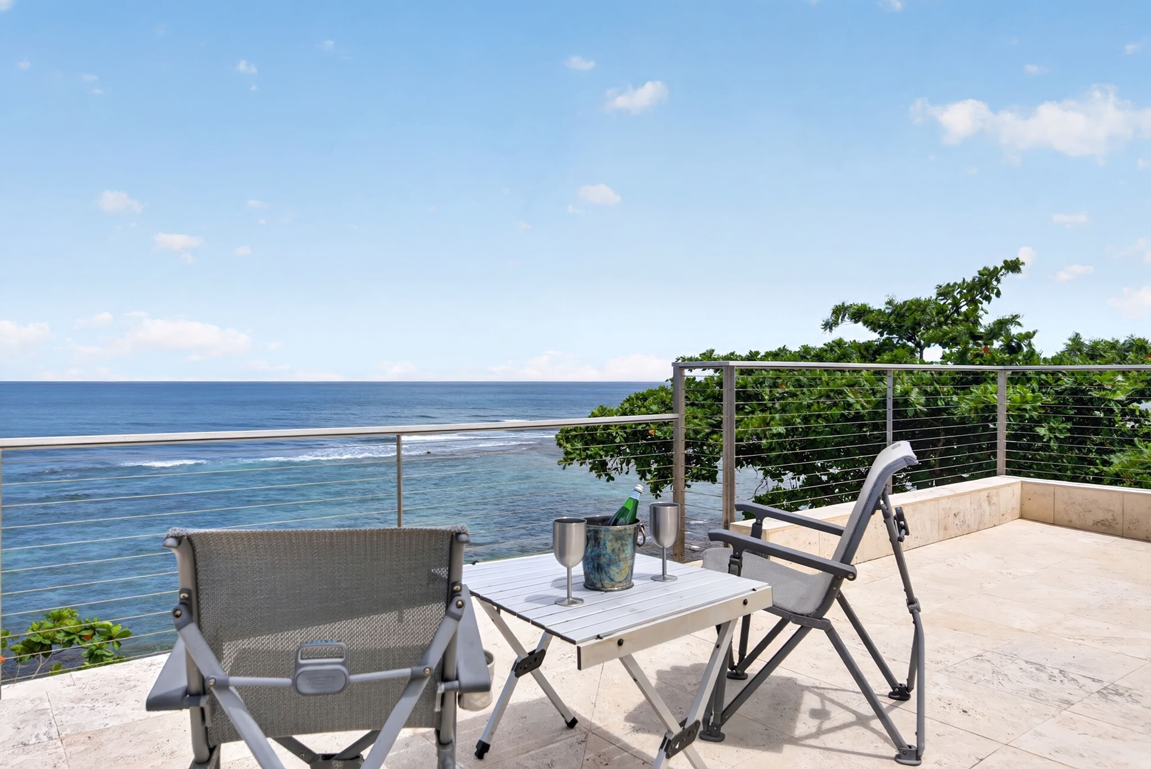 Haleiwa Vacation Rentals, HaleGator - Take in sweeping Pacific views from the oceanfront lanai, where outdoor seating and the sound of the waves create the perfect North Shore retreat.