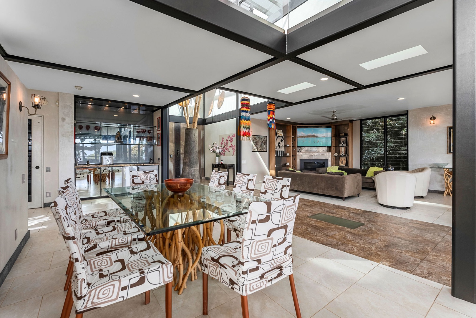 Honolulu Vacation Rentals, Tantalus Glass House (3 BD) - Step into your stunning open-concept haven where natural light streams through striking skylights, illuminating stylish furnishings and creating the perfect space for memorable gatherings.