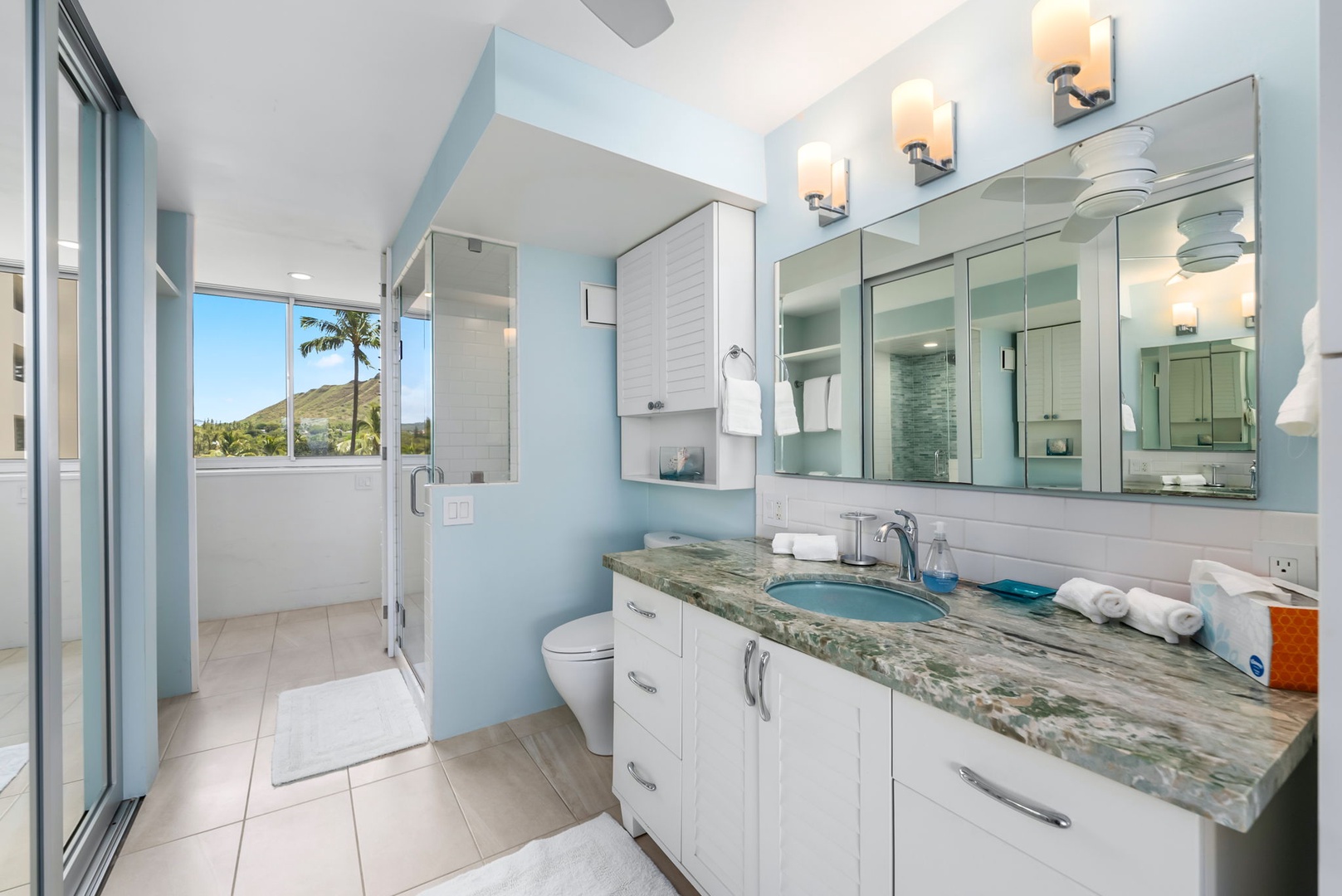 Honolulu Vacation Rentals, Colony Surf Luxe - Coastal tones and full mirrors amplify space and light, giving this bathroom a calming, resort-like feel.