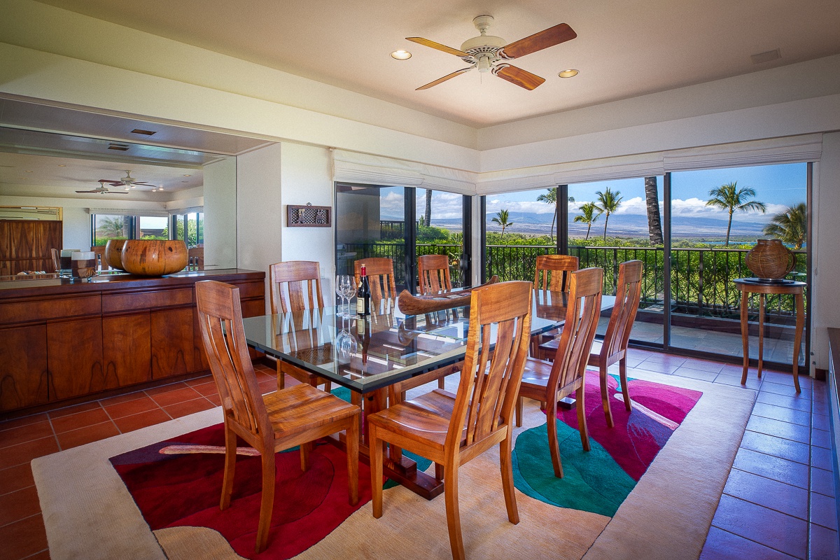 Kamuela Vacation Rentals, Mauna Kea Villas #13 - Elegant dining space for eight, featuring ocean views and a seamless indoor-outdoor experience.