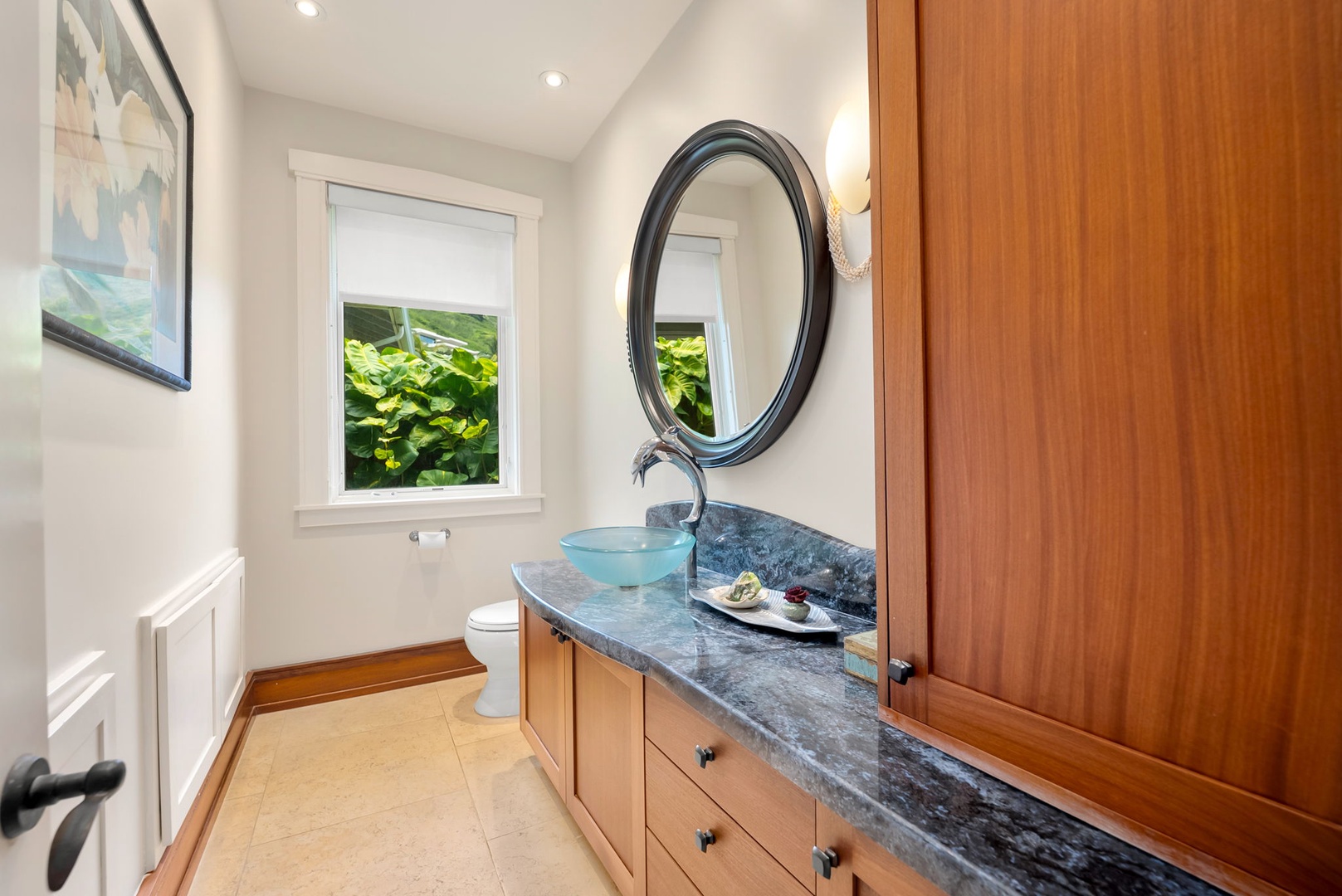 Kailua Vacation Rentals, Leaf House - Step into your private sanctuary, where natural light pours through the window, illuminating elegant marble countertops and a stunning vessel sink. You'll appreciate the thoughtful storage and serene ambiance perfect for unwinding.