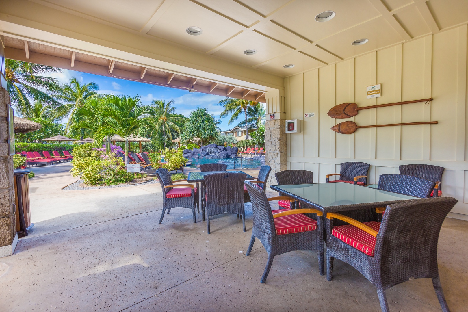 Kapolei Vacation Rentals, Ko Olina Kai 1081C - Lounge with your favorite book by the pool.