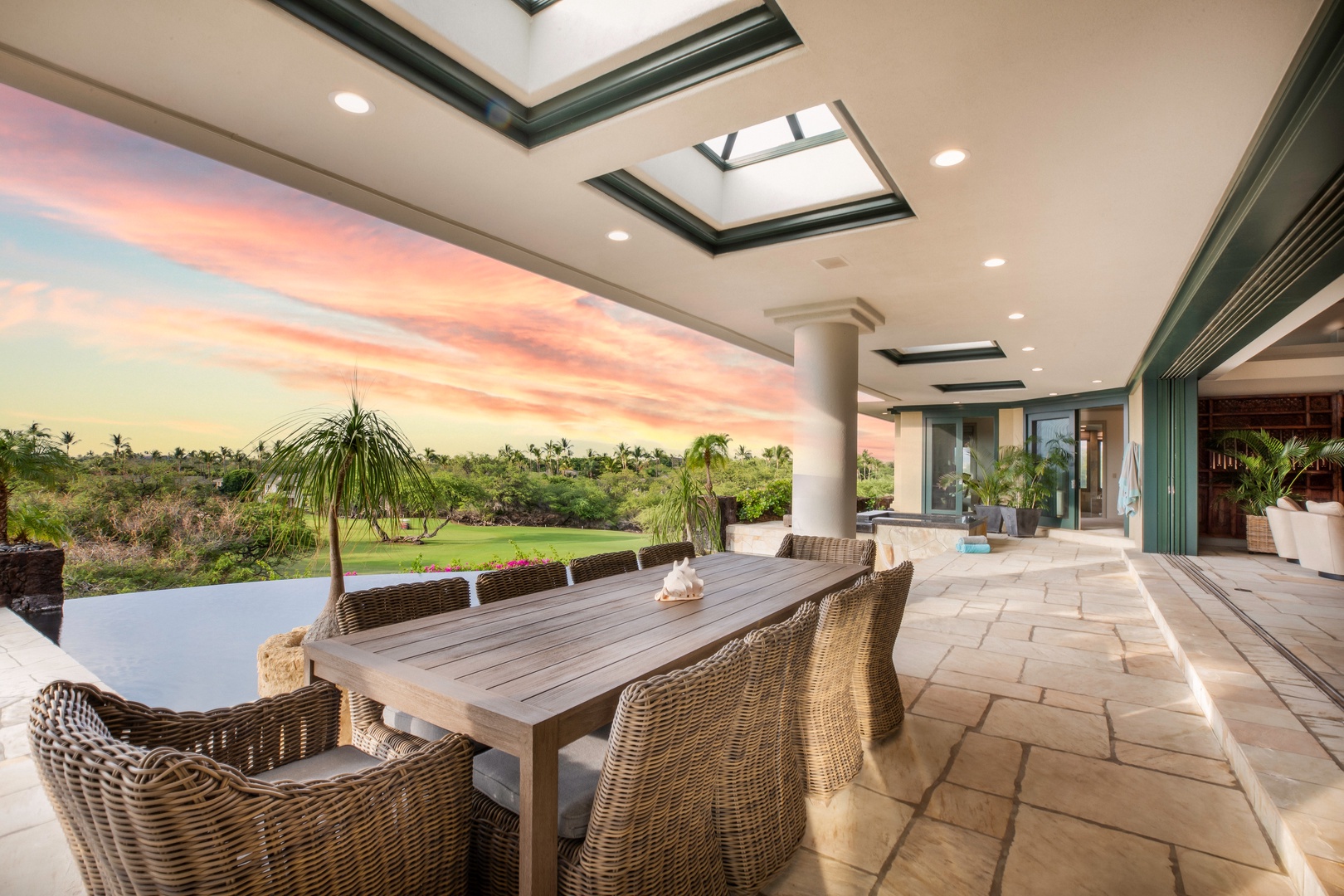 Kamuela Vacation Rentals, Canoe House & Beach Walker at Champion Ridge - Dine al fresco under skylit ceilings with sunset skies and lush tropical backdrops.