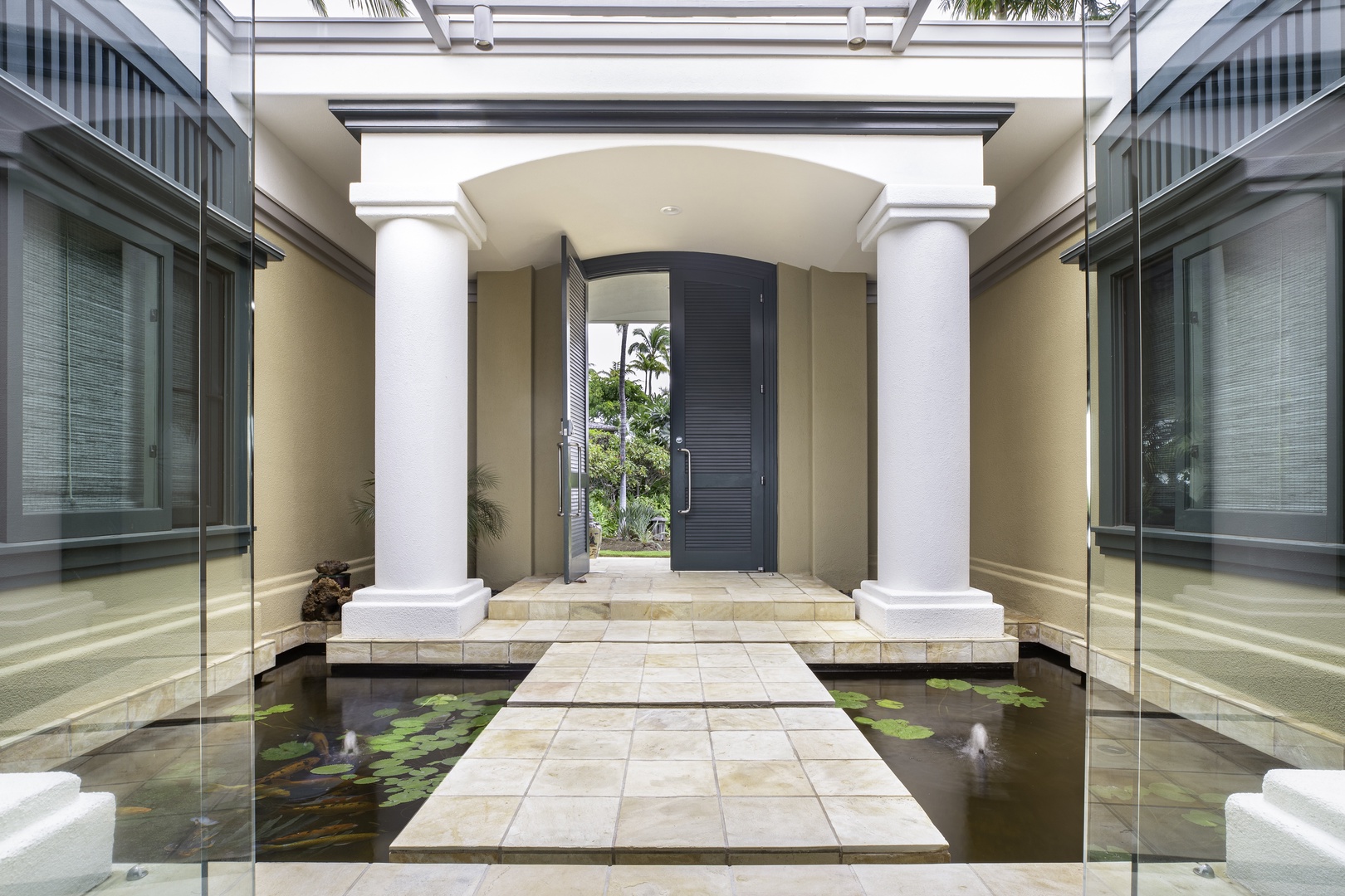 Kamuela Vacation Rentals, Canoe House at Champion Ridge - A grand entrance over a tranquil koi pond sets the tone for this serene island retreat.