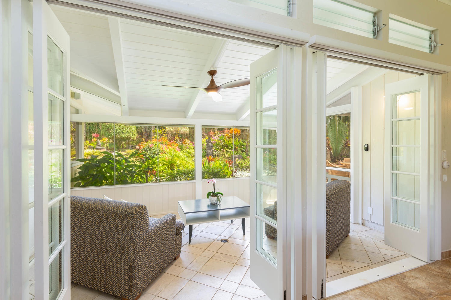 Princeville Vacation Rentals, Mala Hale - Screened lanai offers privacy and a cozy space to read, or enjoy a cup of Kona coffee