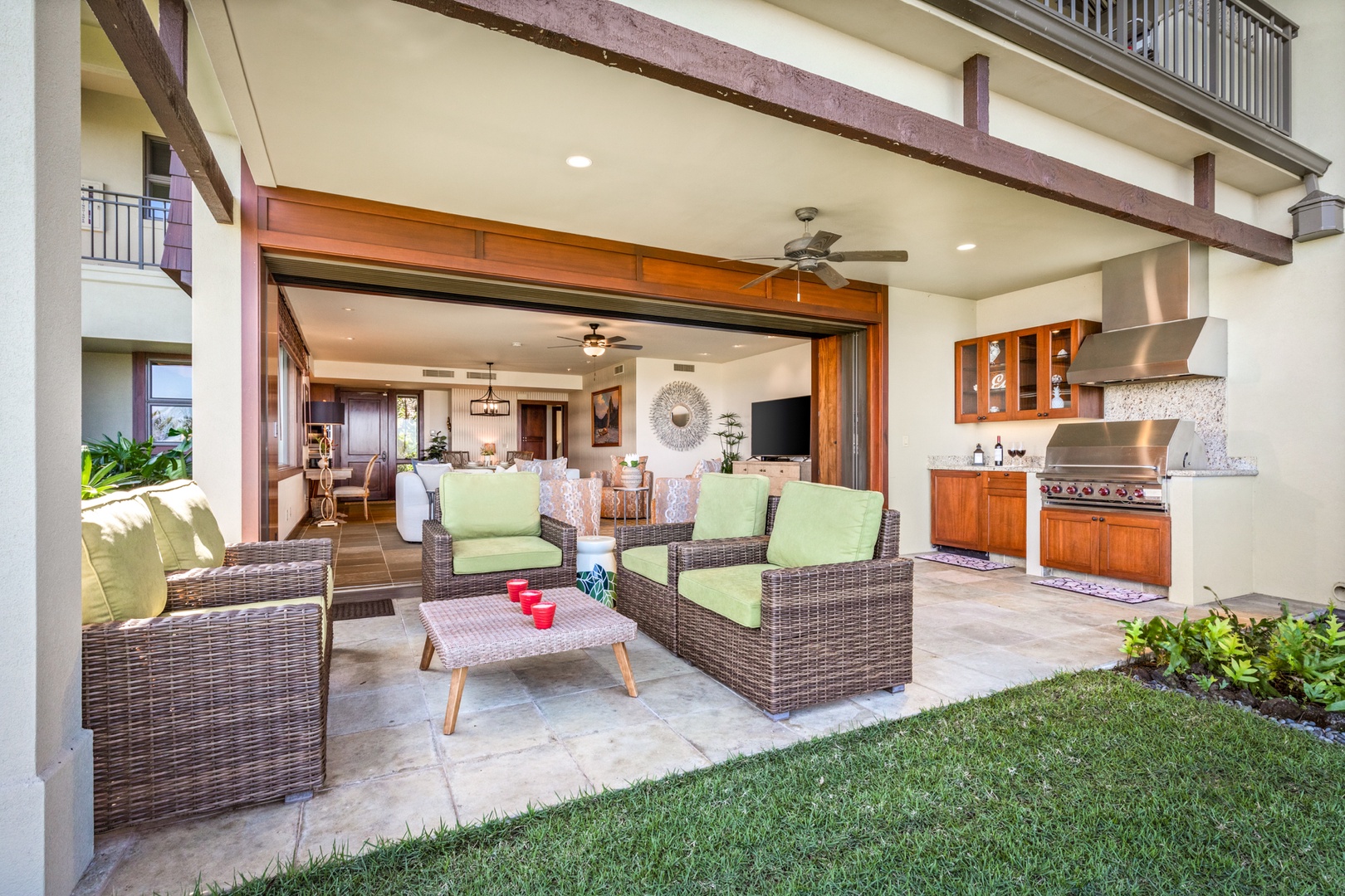 Kailua Kona Vacation Rentals, 3BD Hainoa Villa (2907C) at Four Seasons Resort at Hualalai - Reverse view of lanai from private lawn looking back toward the home through the pocket doors.