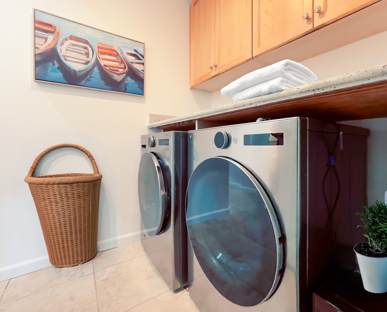 Kamuela Vacation Rentals, Mauna Lani Fairways #603 - Downstairs laundry area with a washer/dryer and direct access to garage.