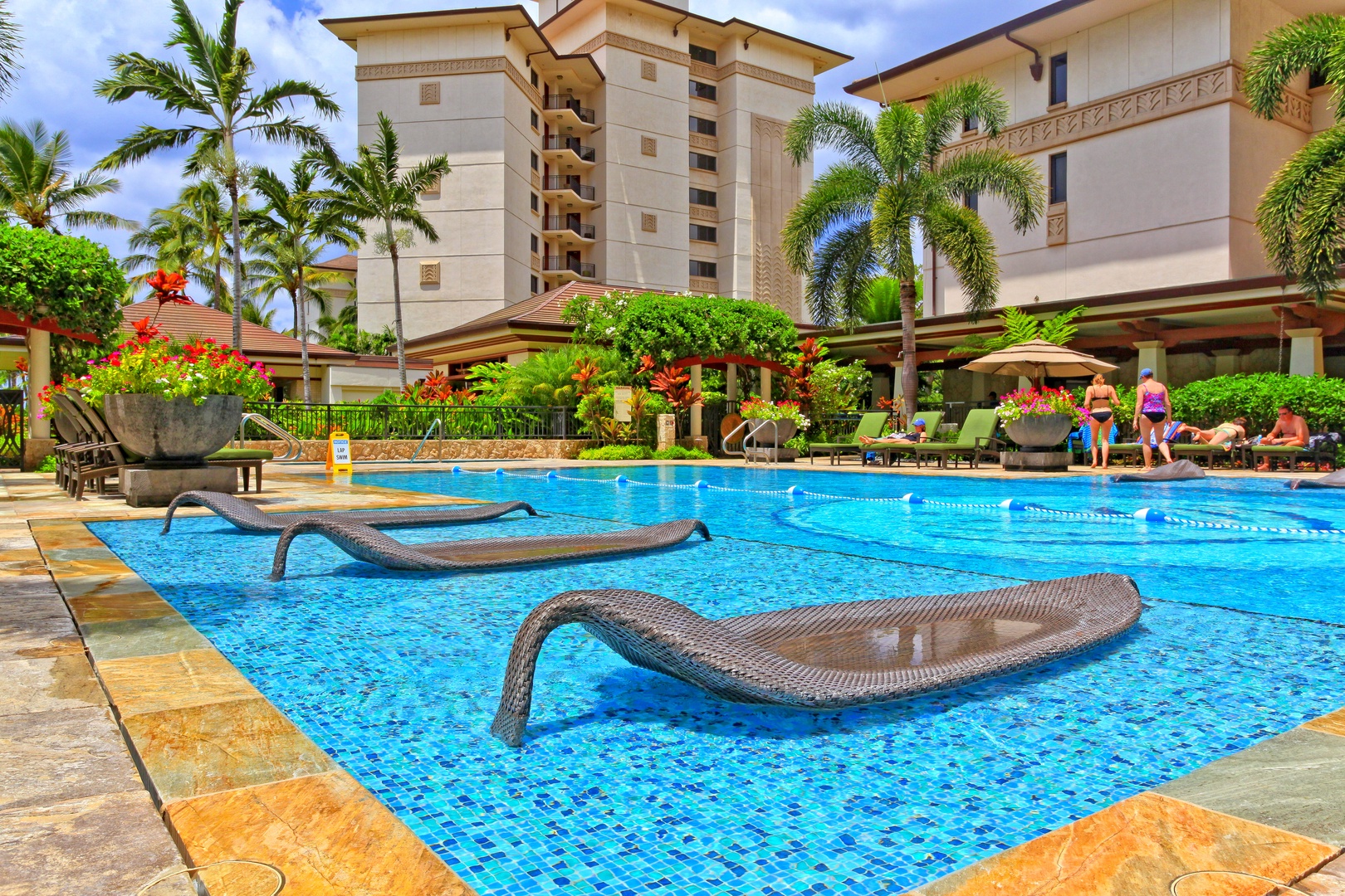 Kapolei Vacation Rentals, Ko Olina Beach Villas B610 - Water loungers at the pool.