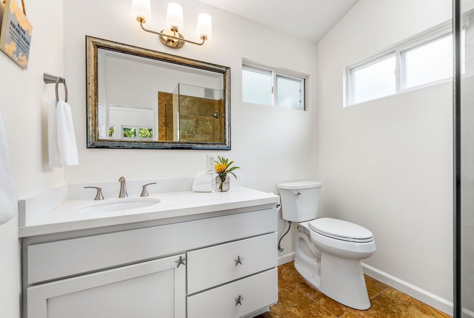 Kailua Vacation Rentals, Nohie Lanikai - Bright and airy bathroom with modern fixtures and fresh towels for a relaxing stay.