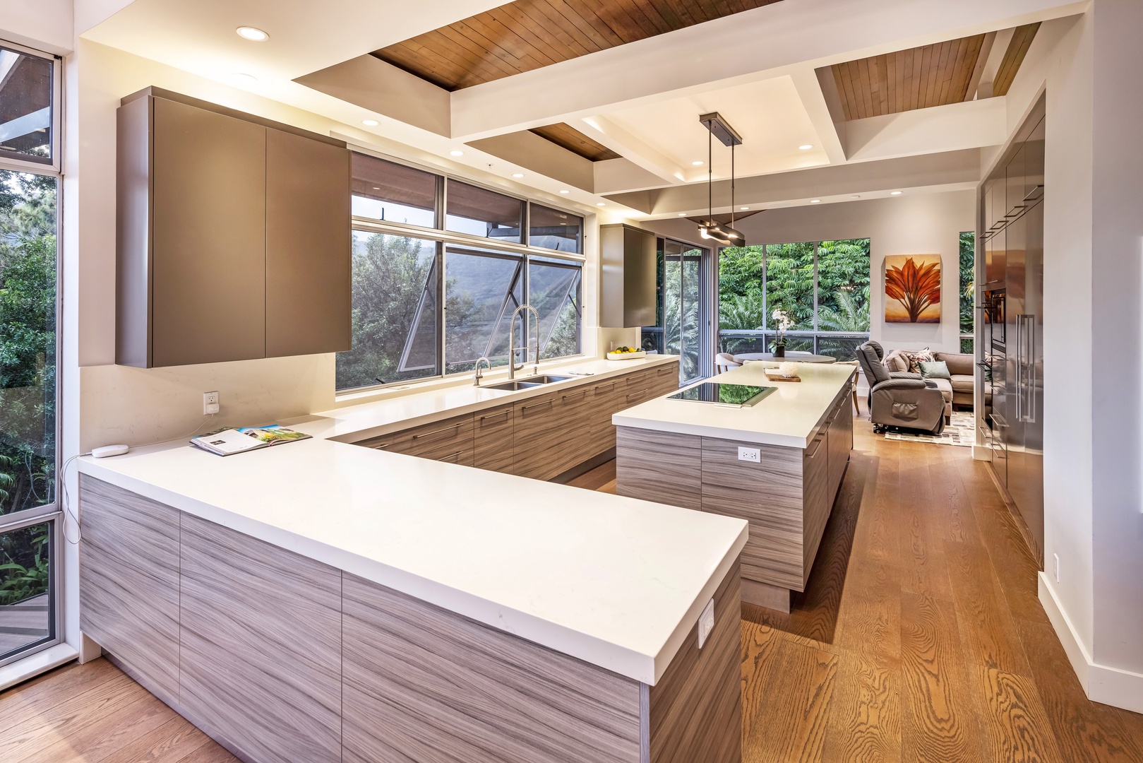Honolulu Vacation Rentals, Manoa Royal Retreat - Sleek, modern kitchen with high-end finishes and floor-to-ceiling windows bringing the outdoors in.