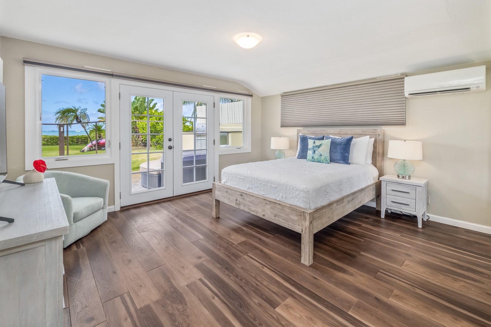 Honolulu Vacation Rentals, Nanea Kai Villa - The secondary suite offers a queen-sized bed and doors leading to a private patio.