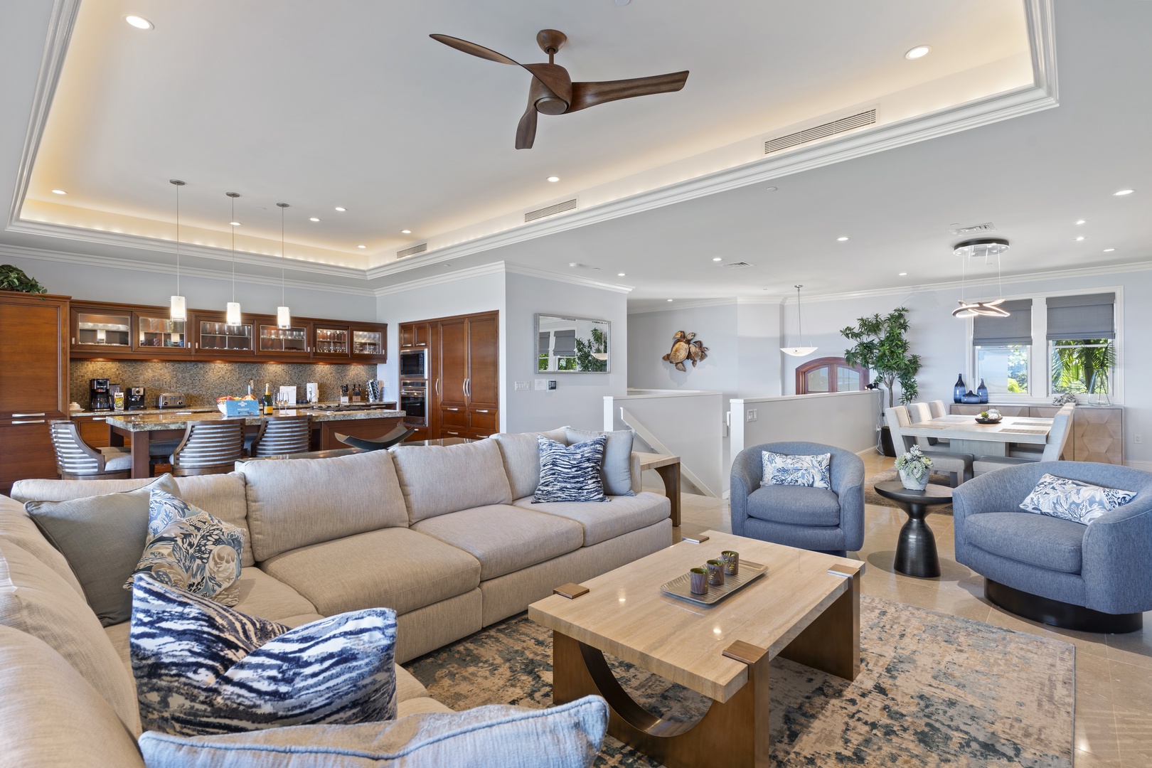 Wailea Vacation Rentals, Wailea Luxury Residence Hoolei 23-3 - The open-concept living area invites you to unwind in comfort, with ample seating and a seamless flow into the gourmet kitchen and dining space.