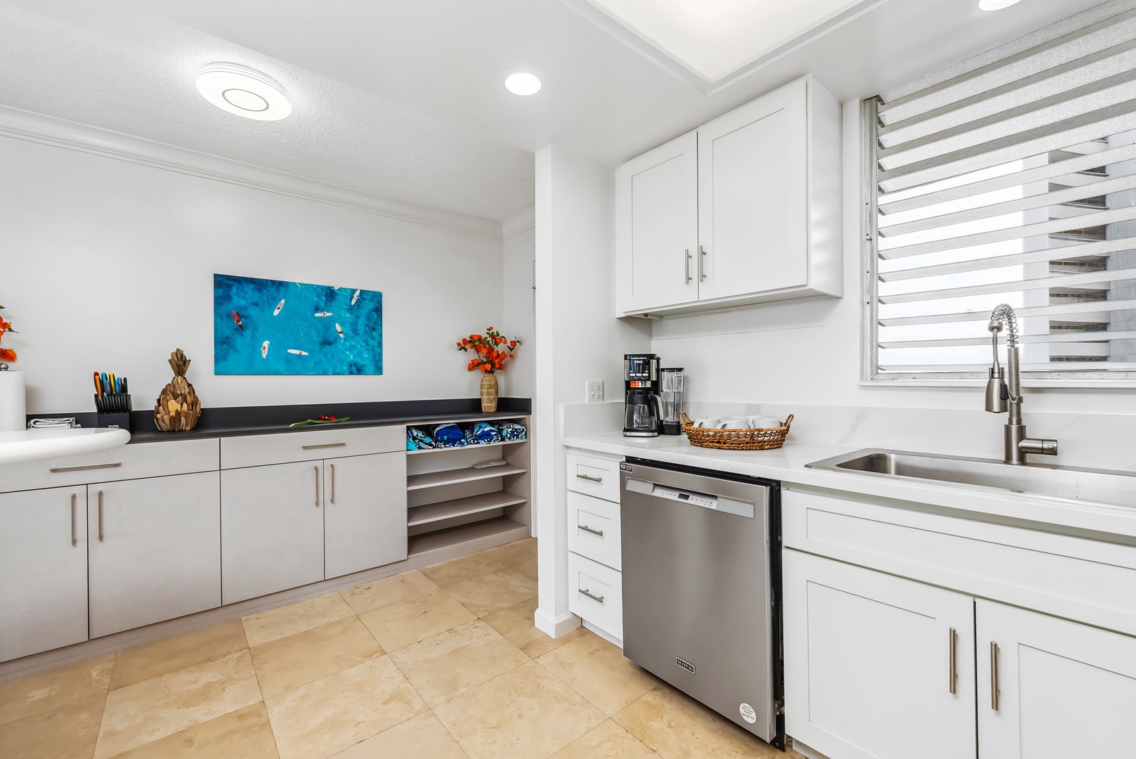 Honolulu Vacation Rentals, Colony Surf Getaway - Cozy kitchen corner with a dishwasher, large sink, and modern design for everyday comfort.