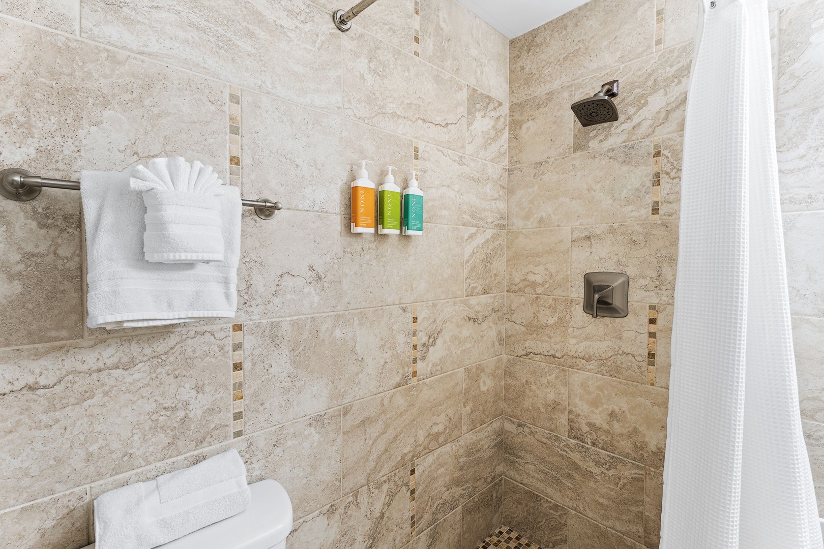 Kailua-Kona Vacation Rentals, Honu Hale - Unwind in your luxurious stone-tiled shower with rainfall showerhead, premium amenities, and plush towels awaiting your arrival.