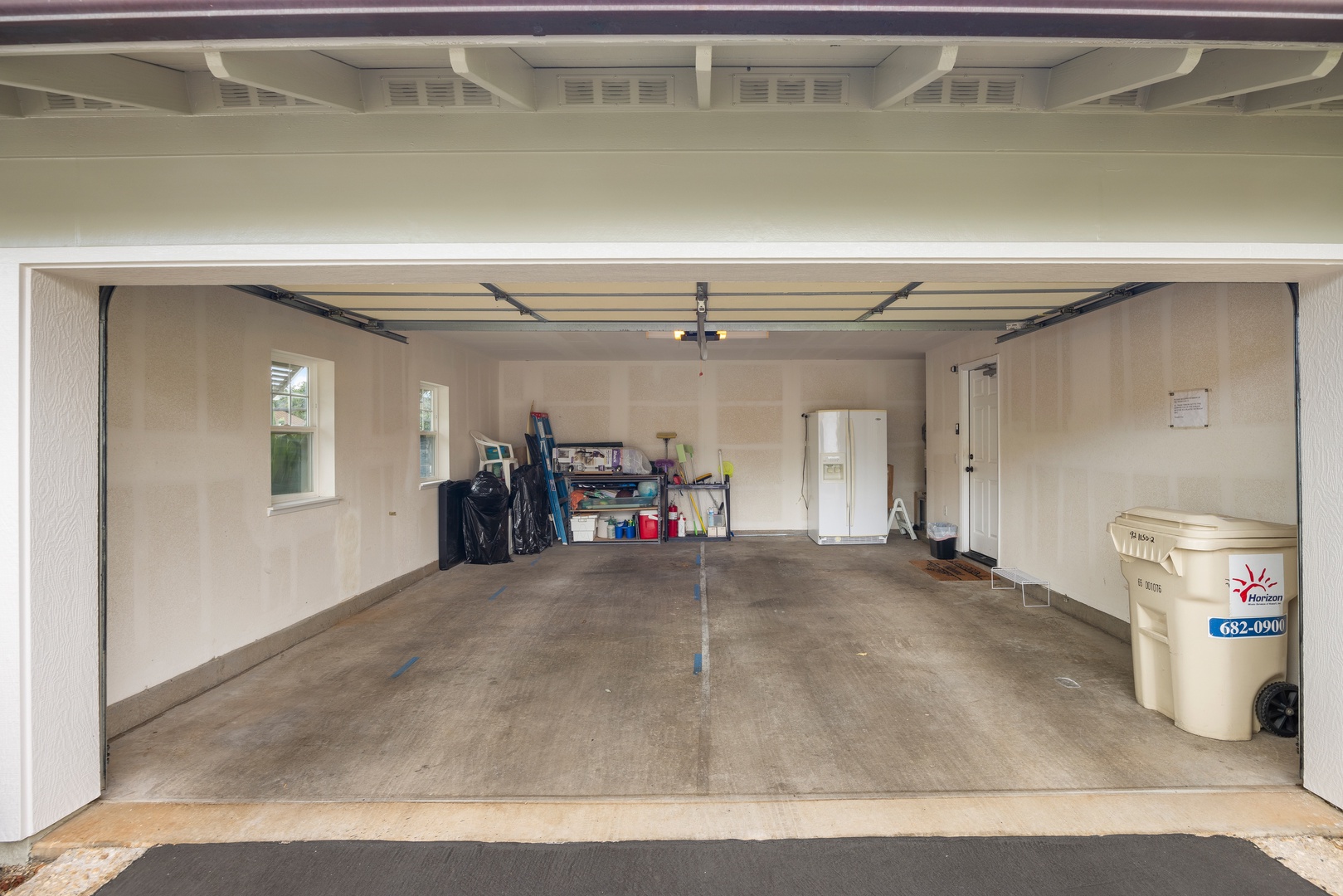 Kapolei Vacation Rentals, Coconut Plantation 1150-2 - Your dedicated garage offers secure parking and additional storage space for your convenience during your stay.