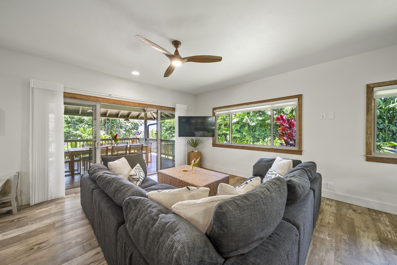 Haleiwa Vacation Rentals, Kaunala Retreat - Cozy lounge area ideal for reading, relaxing, or morning coffee surrounded by lush outdoor views.