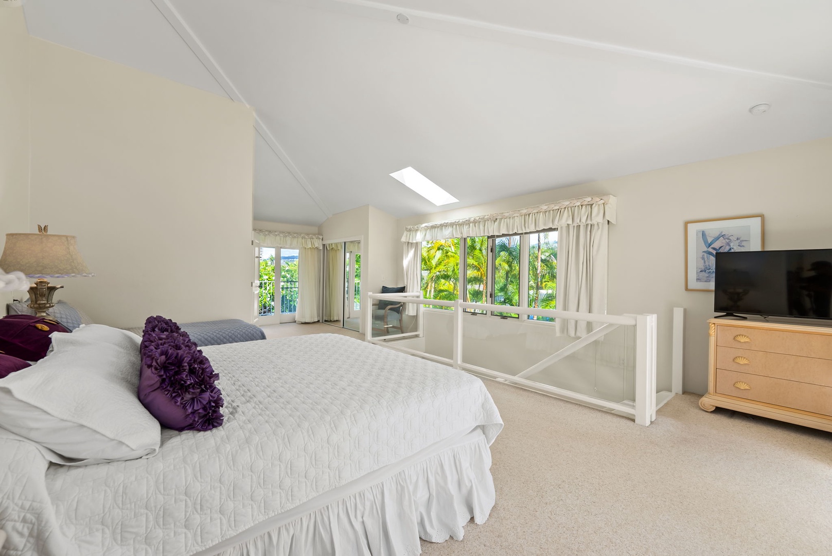 Honolulu Vacation Rentals, Kahala Oasis - Spacious bedroom in the family den with a skylight, filling the room with soft, natural light for a peaceful ambiance.