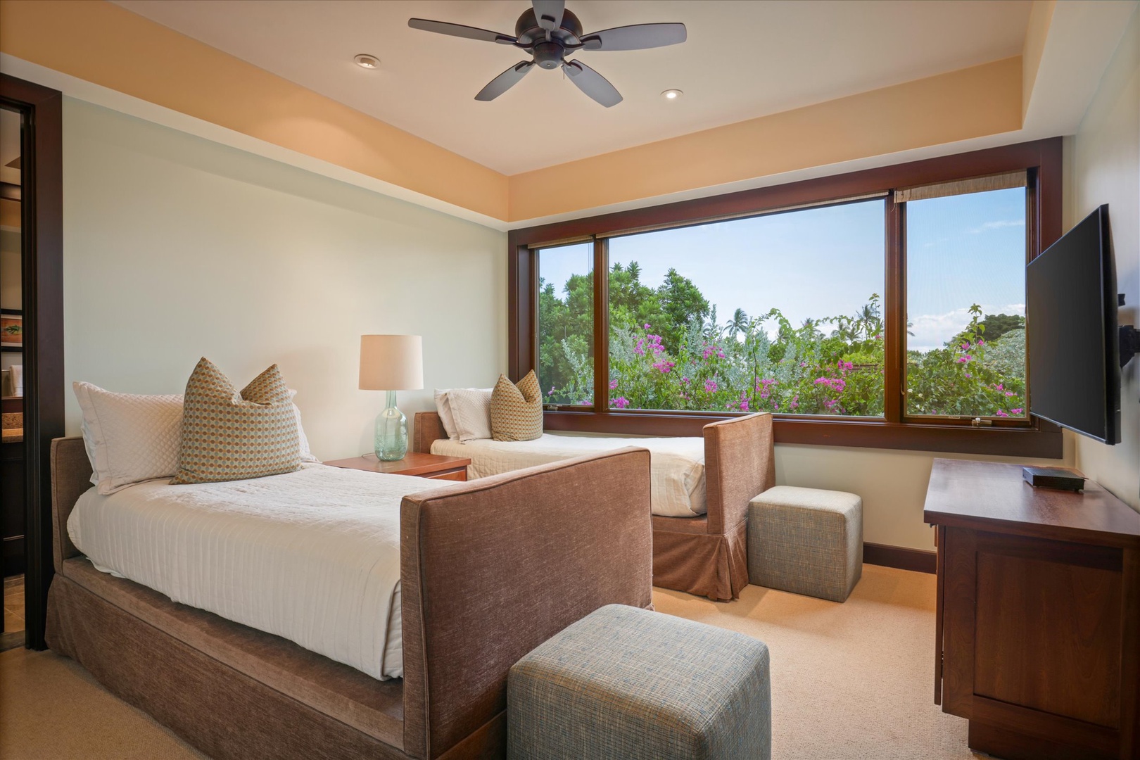 Kailua Kona Vacation Rentals, Wai'ulu Villa 115D - Guest bedroom with tropical garden views, soft neutral tones, and direct lanai access.
