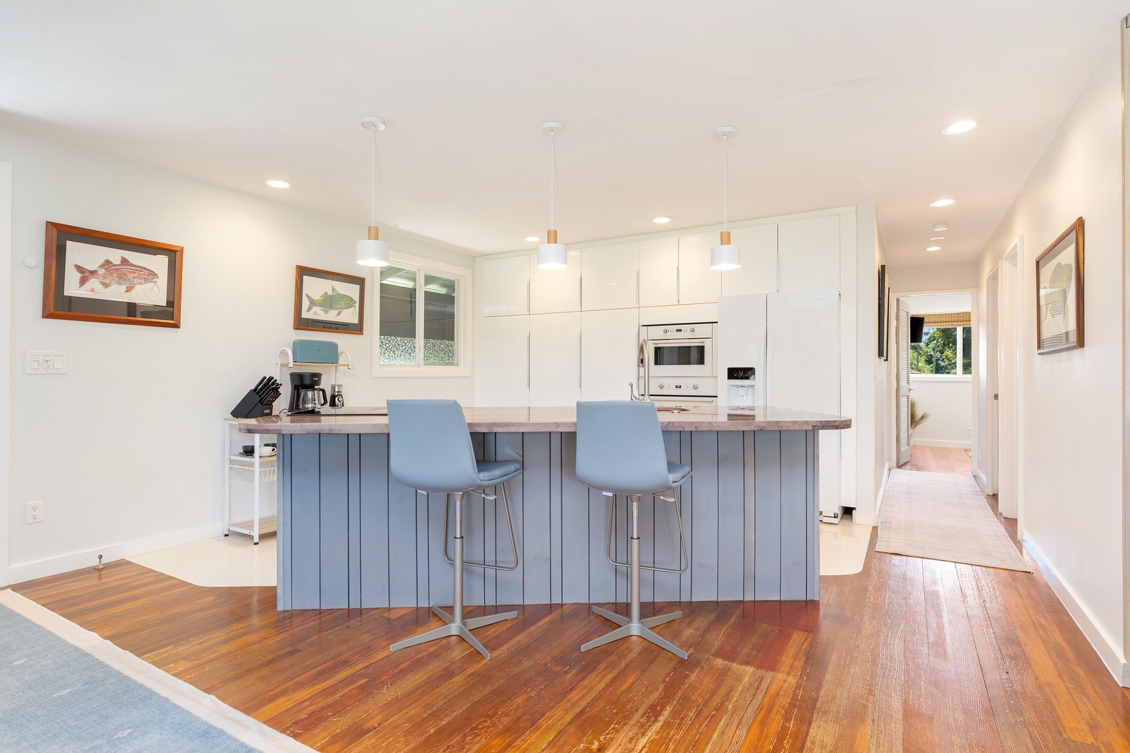 Haleiwa Vacation Rentals, Velzey Ohana Villa (4B Vacation Home) - The chef’s kitchen features a central island, bar seating, and everything you need to cook at home.