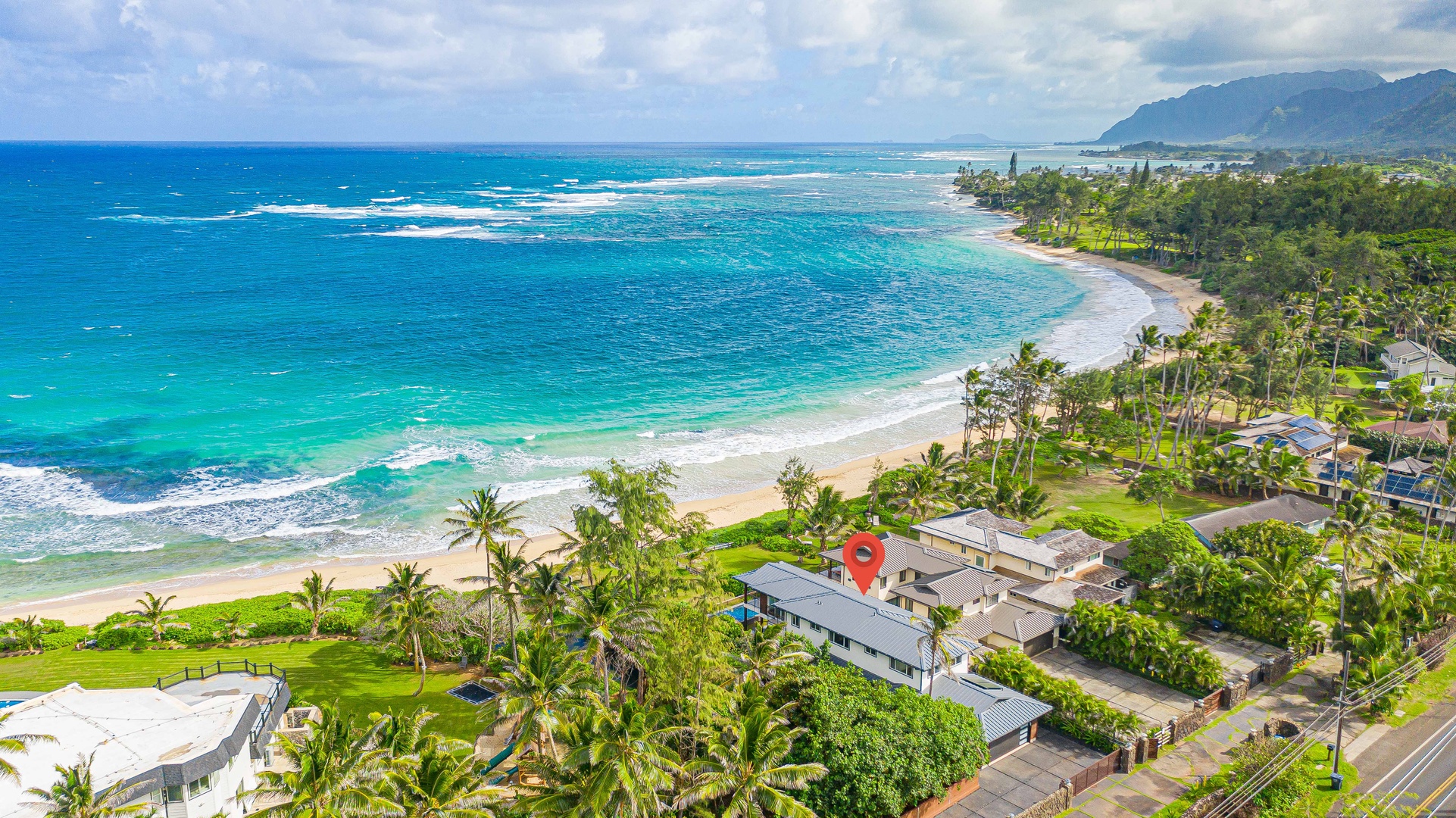 Laie Vacation Rentals, Majestic Mahakea Oceanfront Oasis - A stunning aerial view showcasing the turquoise waters and sandy beaches of this tropical getaway.