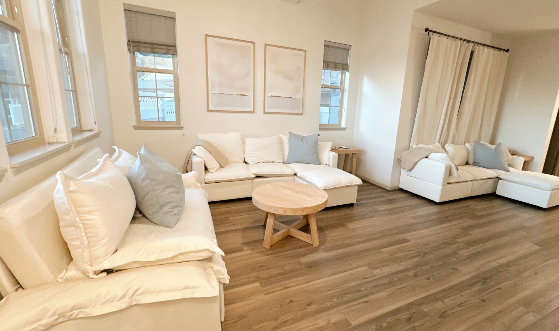Makaha Valley Vacation Rentals, Makaha Valley Hale Kai** - Sunlit lounge with sectional sofa, a calm retreat for reading or relaxing.