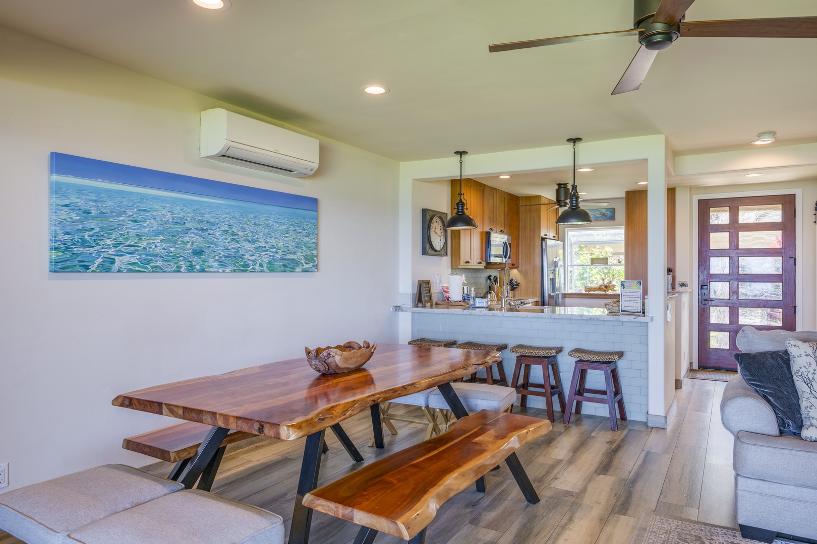 Lahaina Vacation Rentals, Puamana 240-3 - Gather around the rustic wooden dining table, perfect for family meals or lively conversations.